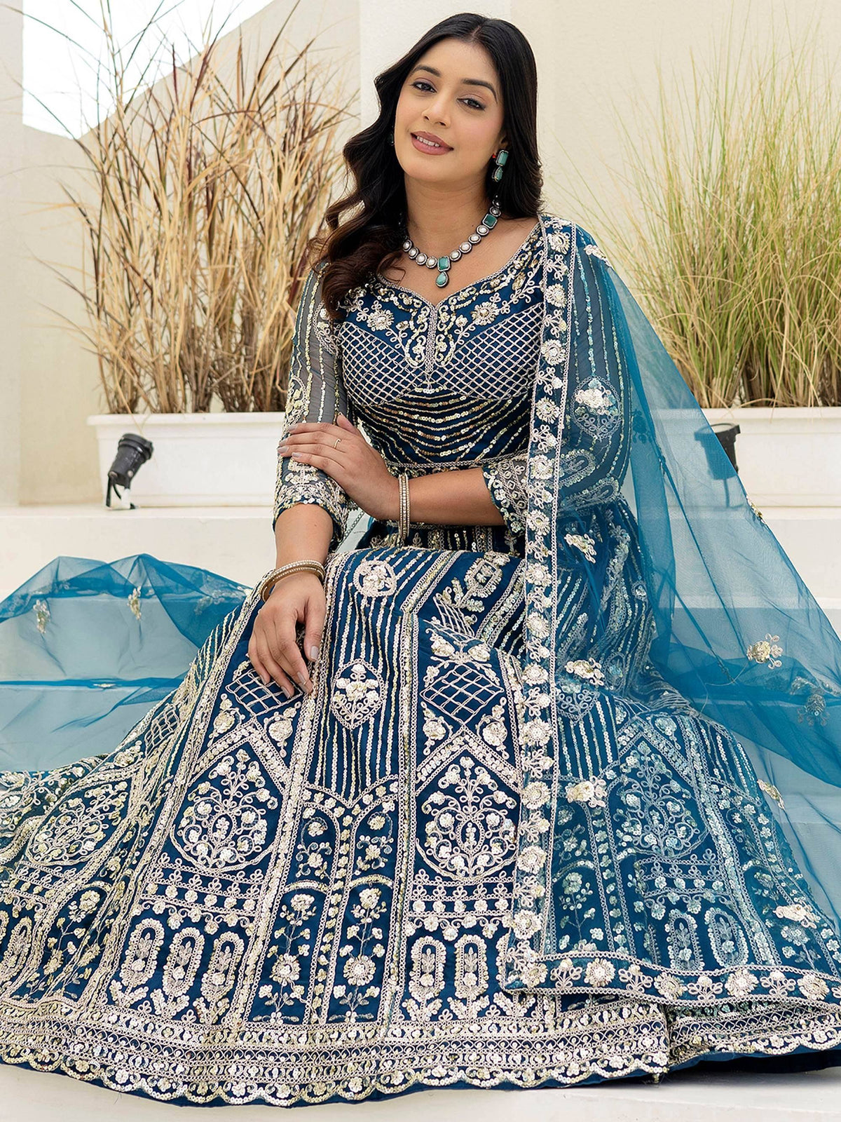Elegant blue embroidered lehenga choli with gold detailing, perfect for Indian ethnic wear occasions.