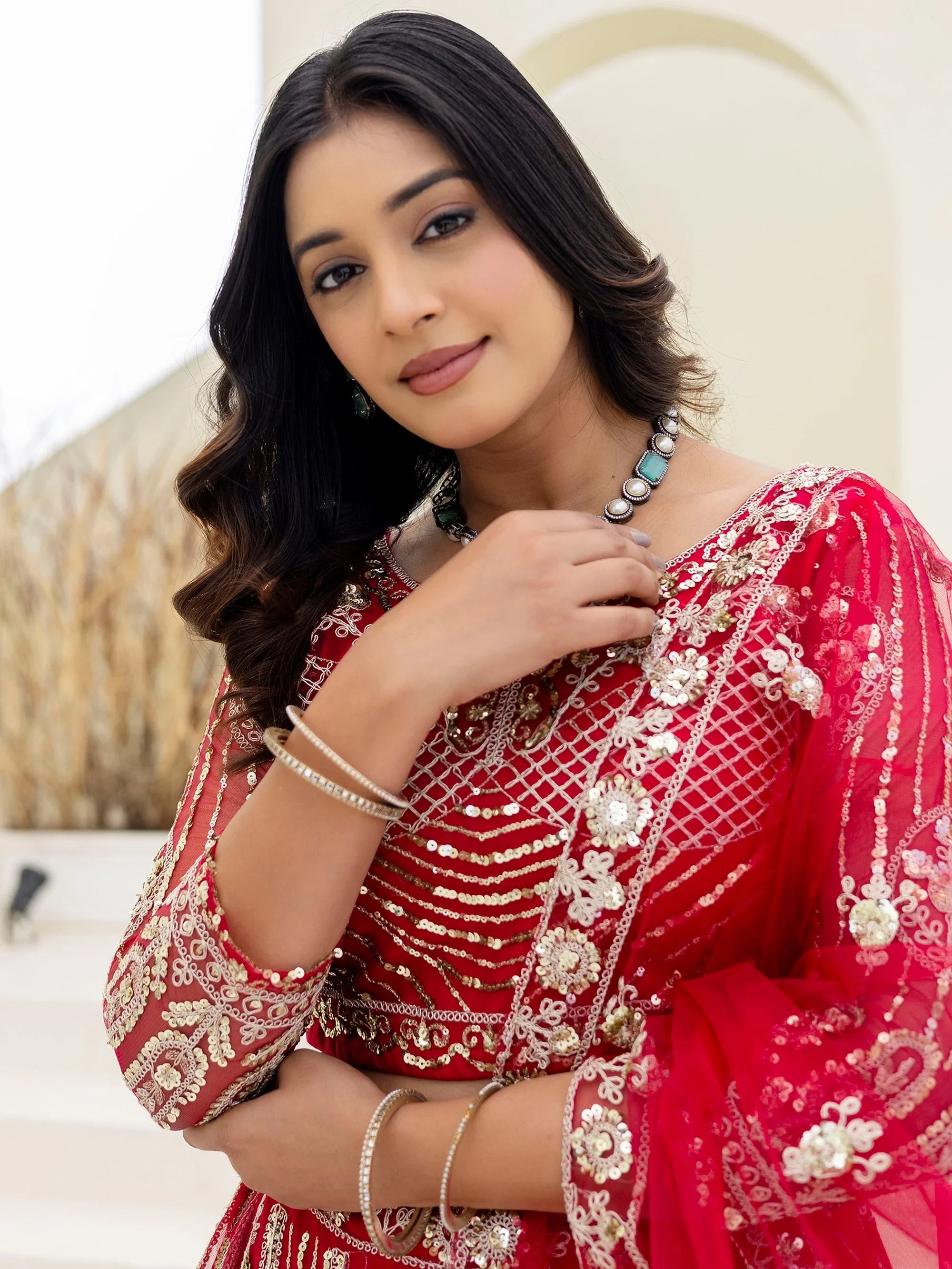 Charming Red Sequins Embroidered Net Reception Wear Lehenga Choli