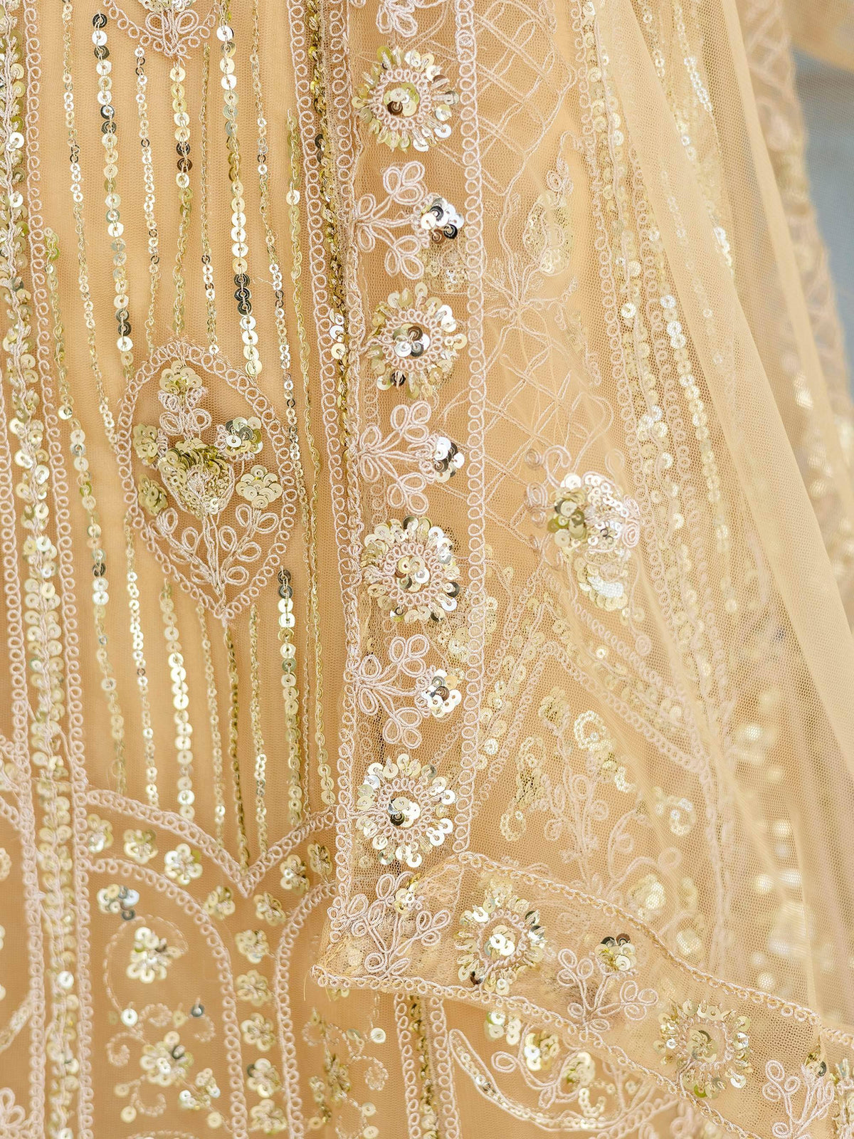 Gold sequin and lace embroidered ethnic gown detail, perfect for Indian weddings and festive occasions.