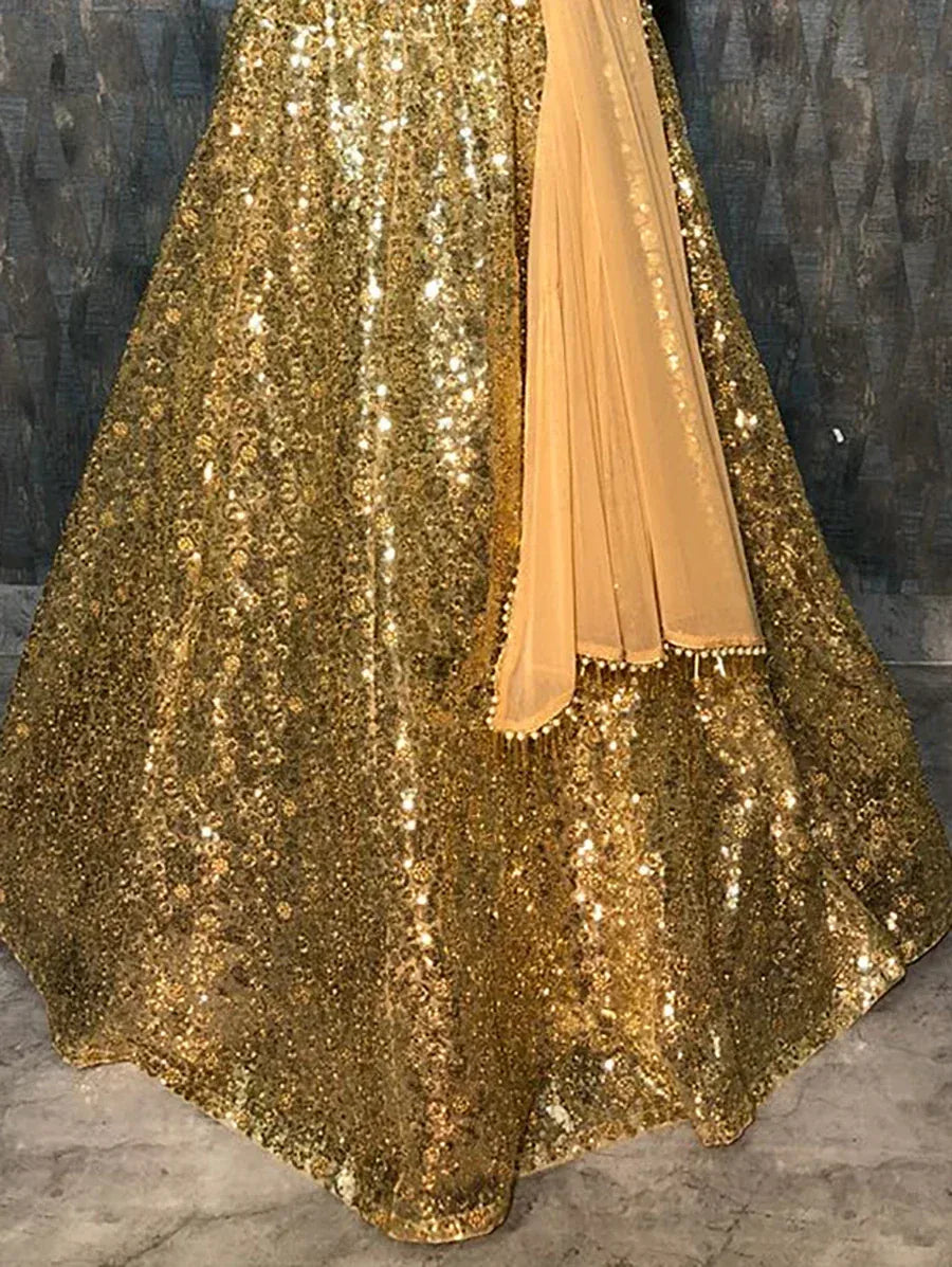 Gold sequin lehenga choli with peach dupatta, ethnic Indian wear for weddings and parties