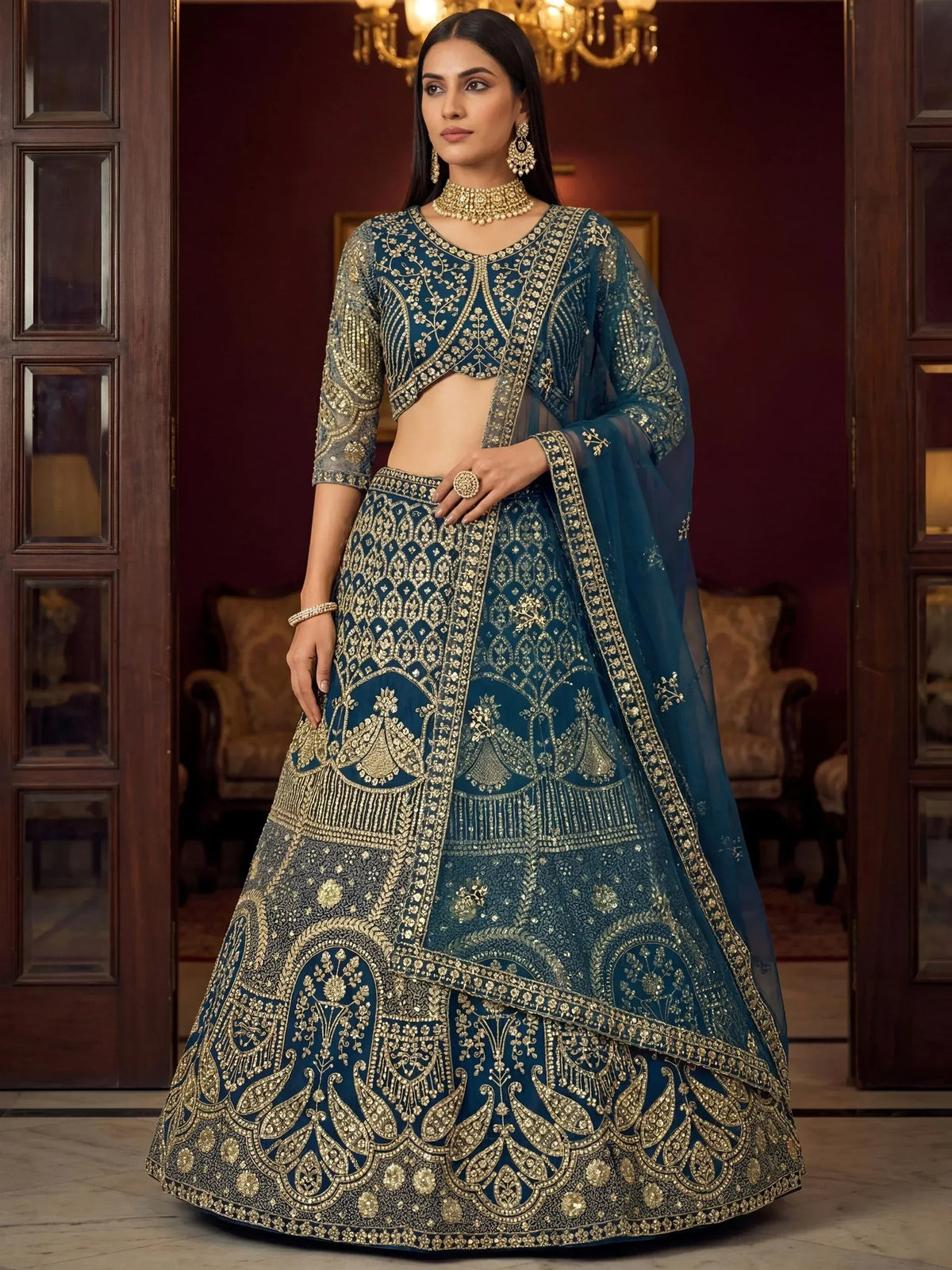 Elegant teal lehenga choli with gold embroidery, perfect for Indian weddings and festive occasions.
