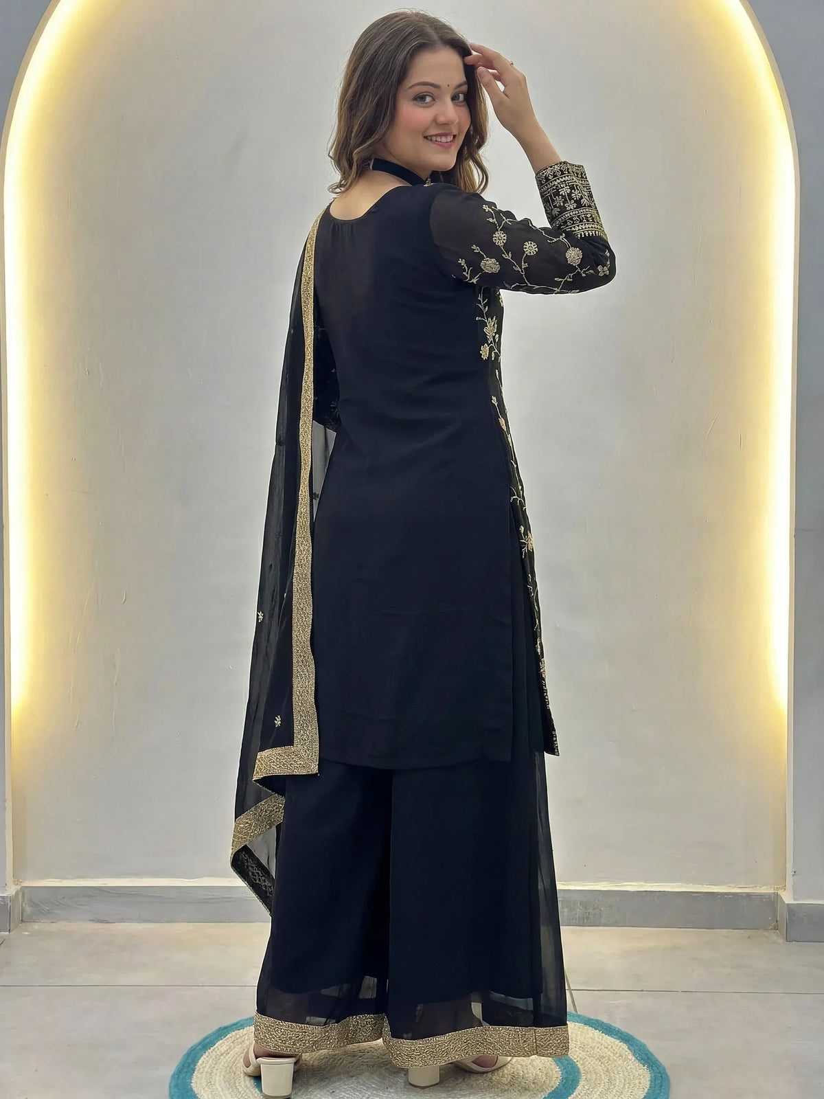 Black embroidered salwar kameez with gold detailing, stylish ethnic wear for women