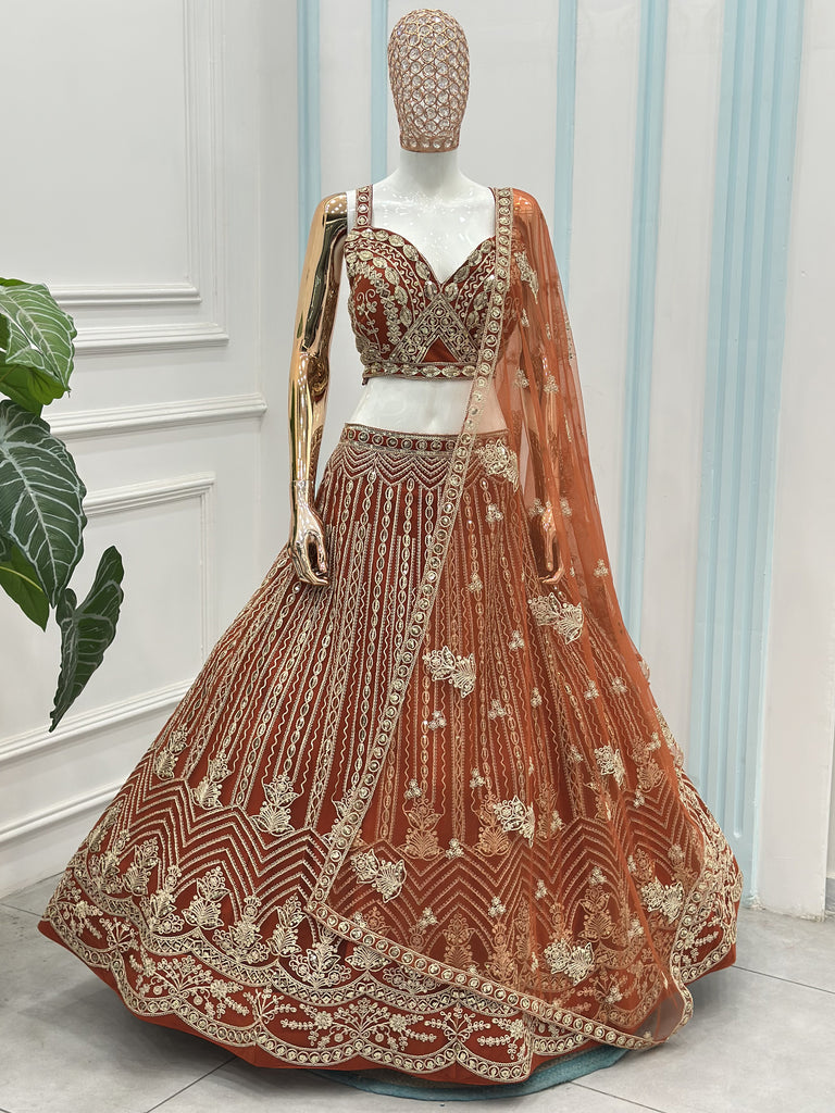 Grand Orange Heavy Embroidered Net Reception Wear Lehenga Choli