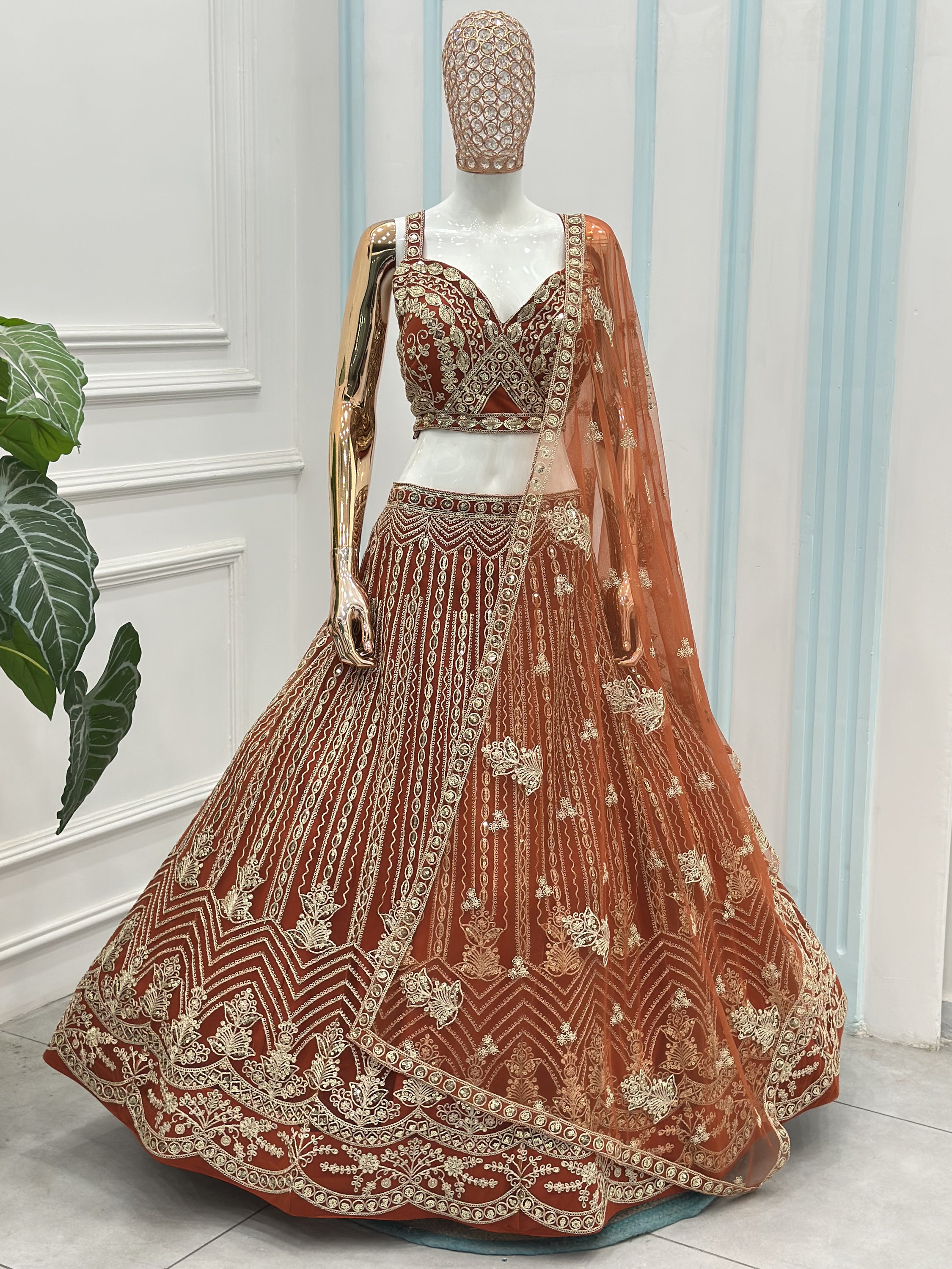 Grand Orange Heavy Embroidered Net Reception Wear Lehenga Choli