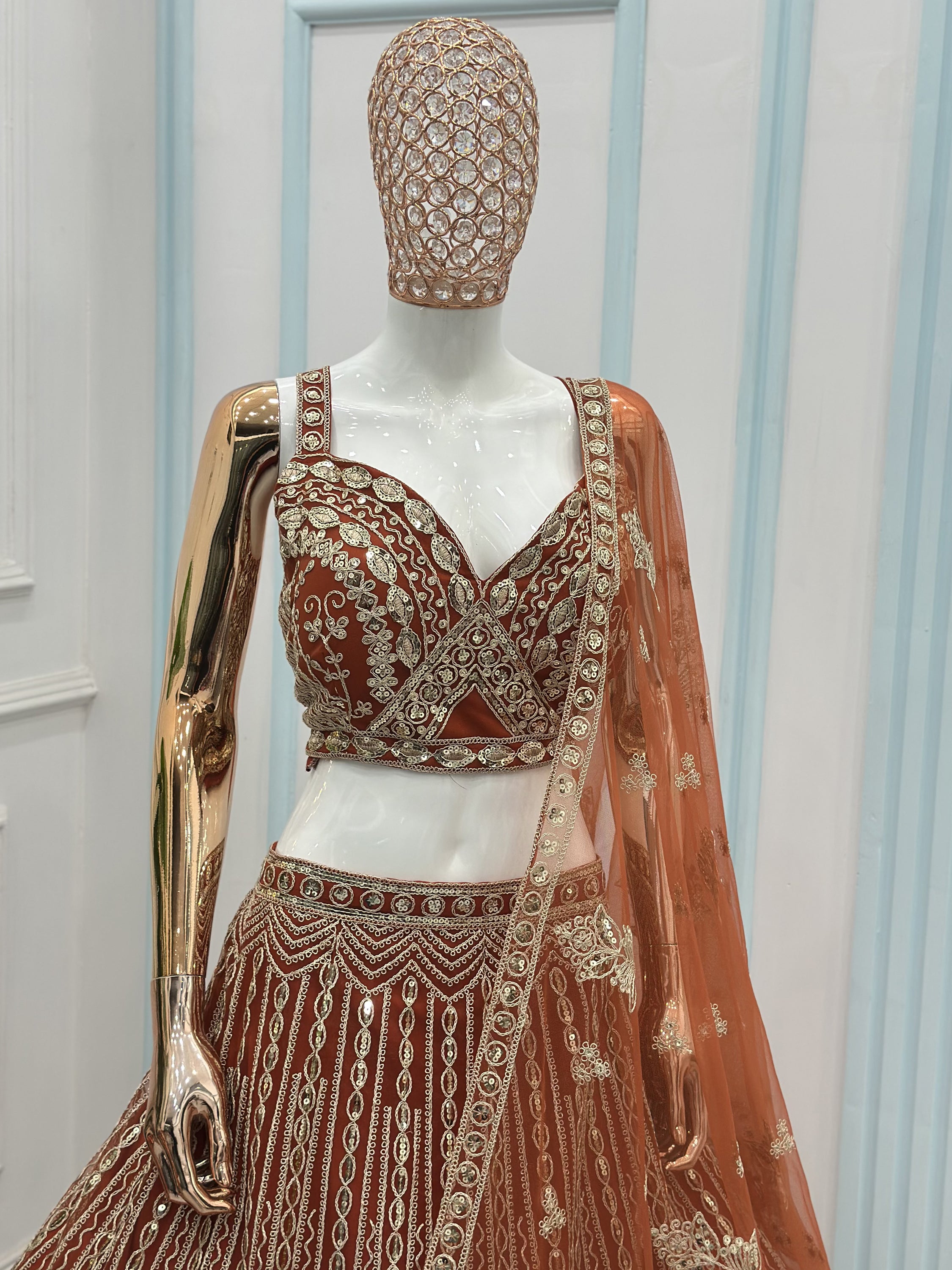 Grand Orange Heavy Embroidered Net Reception Wear Lehenga Choli