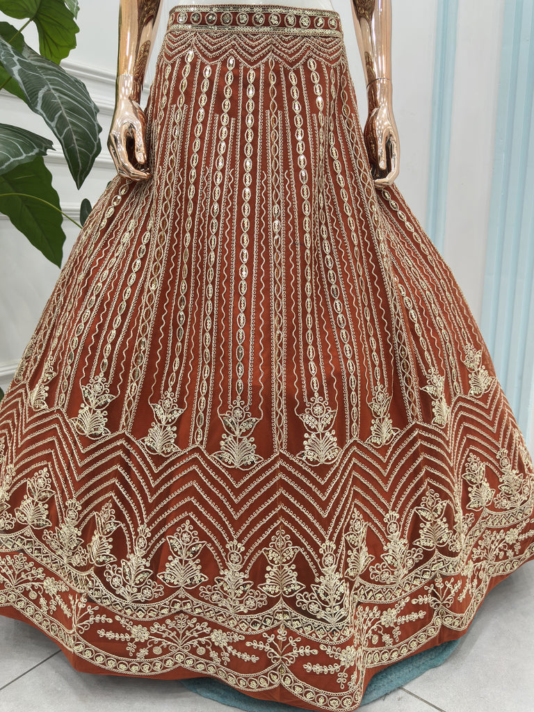 Grand Orange Heavy Embroidered Net Reception Wear Lehenga Choli