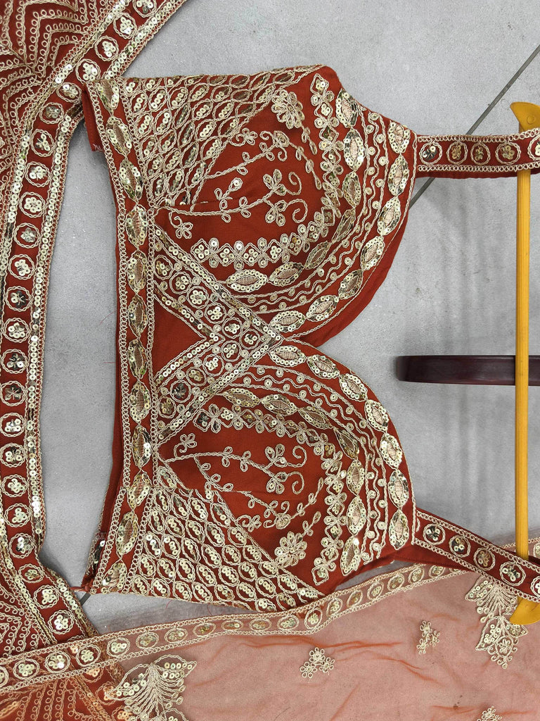 Grand Orange Heavy Embroidered Net Reception Wear Lehenga Choli