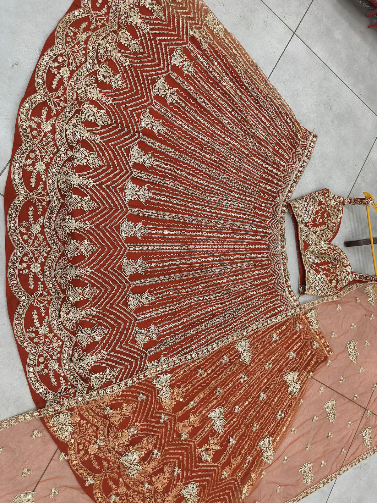 Grand Orange Heavy Embroidered Net Reception Wear Lehenga Choli