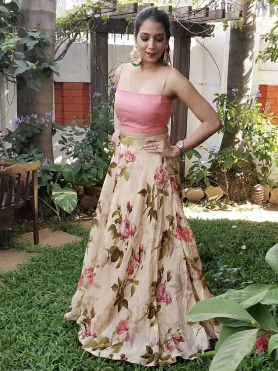 Woman in pink floral lehenga choli, Indian ethnic wear, garden setting