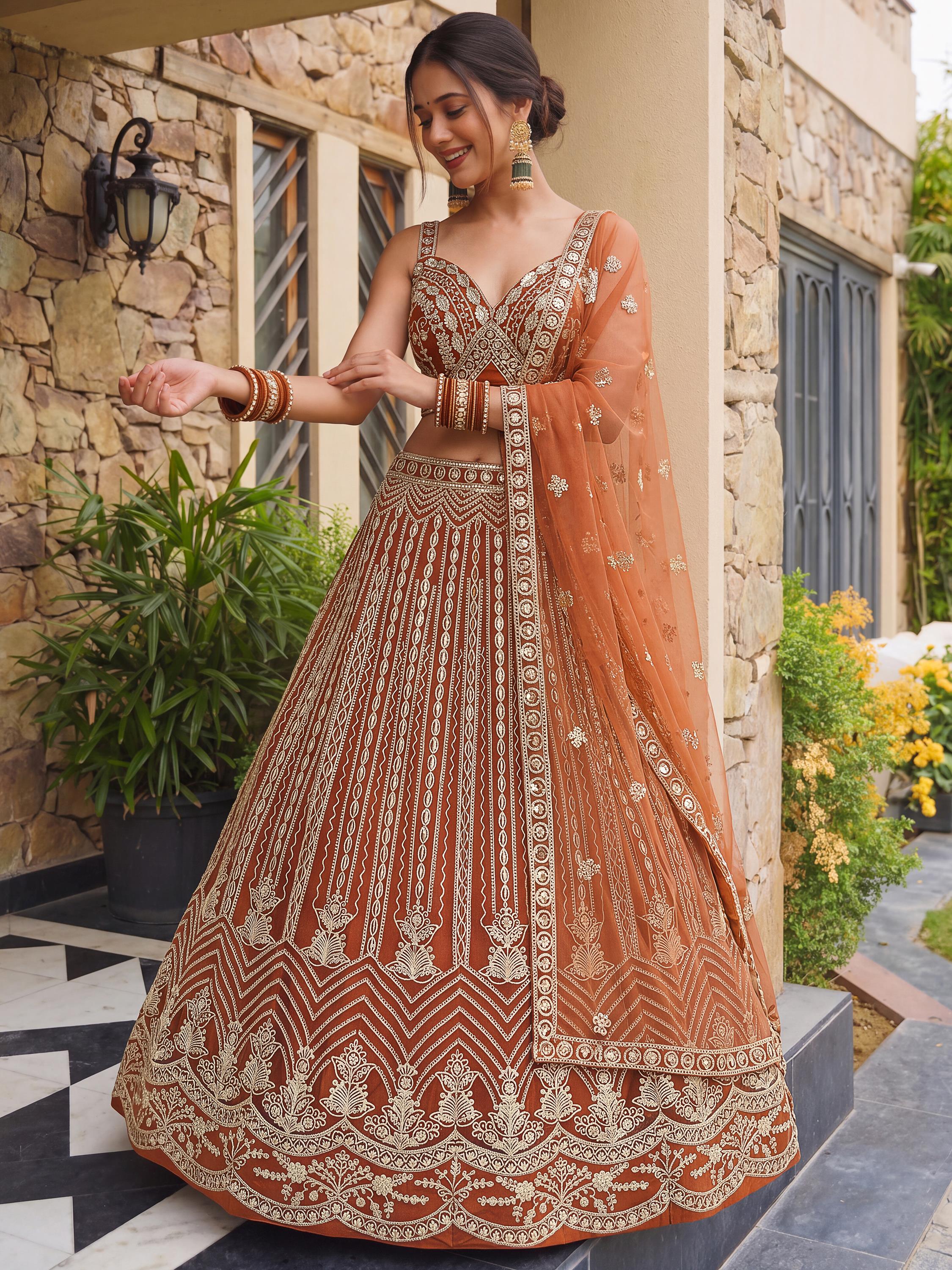 Grand Orange Heavy Embroidered Net Reception Wear Lehenga Choli