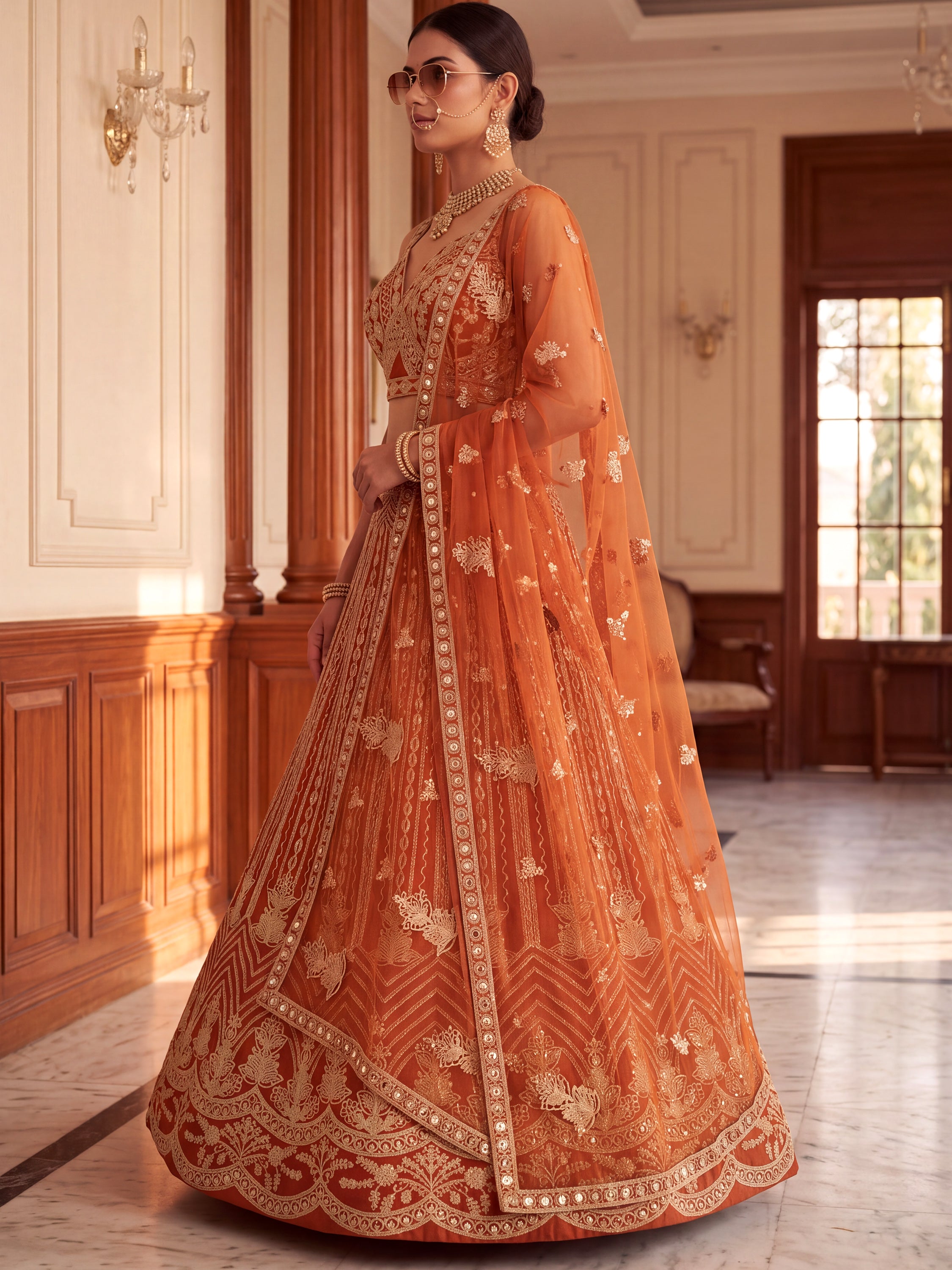 Grand Orange Heavy Embroidered Net Reception Wear Lehenga Choli