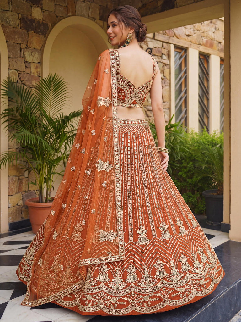 Grand Orange Heavy Embroidered Net Reception Wear Lehenga Choli