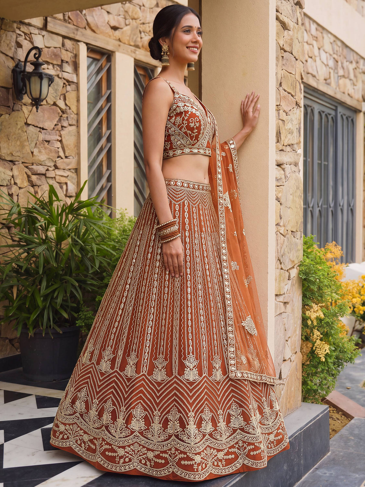 Grand Orange Heavy Embroidered Net Reception Wear Lehenga Choli