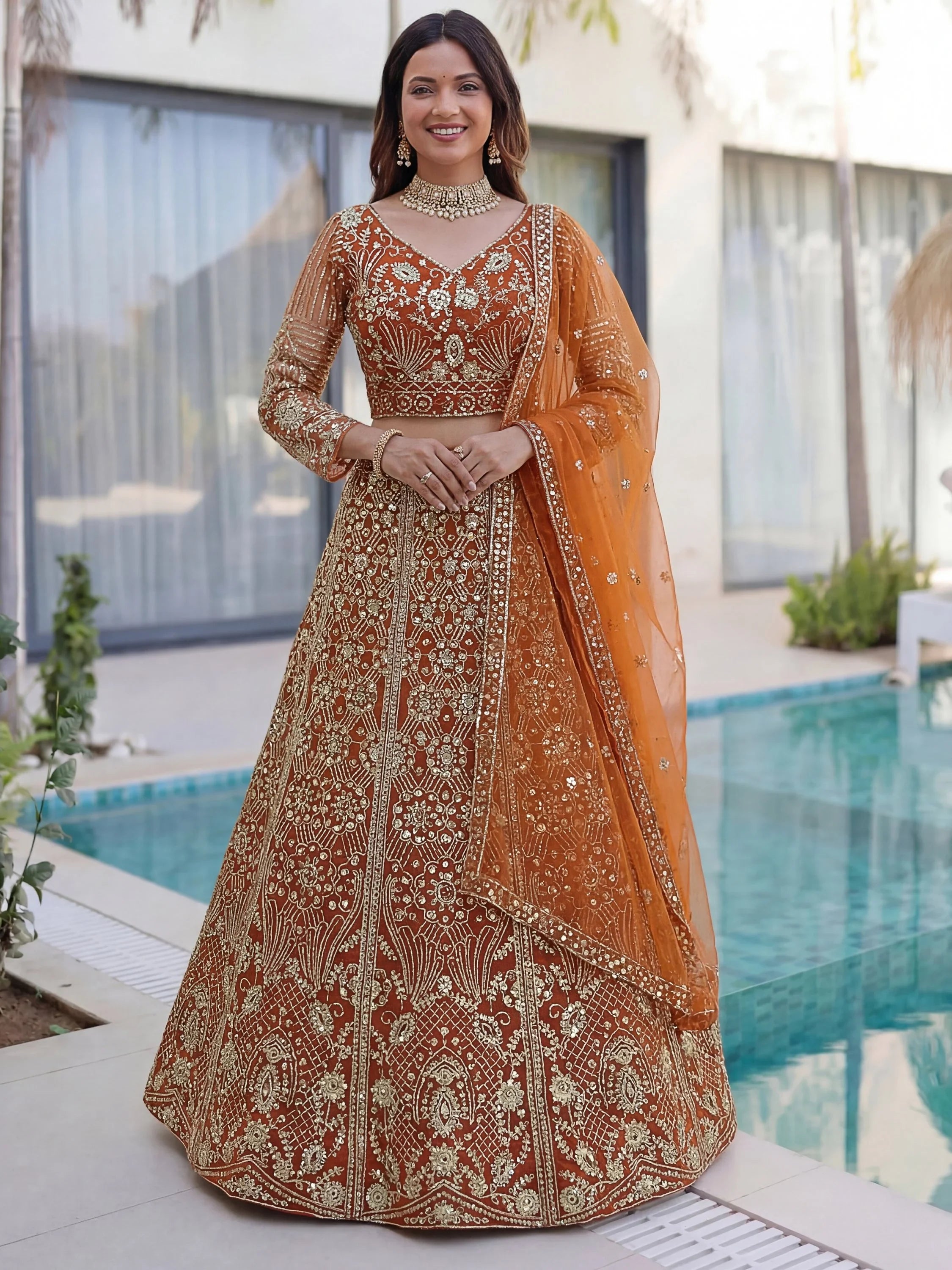 Gorgeous Orange Sequins Net Evening Wear Lehenga Choli With Dupatta