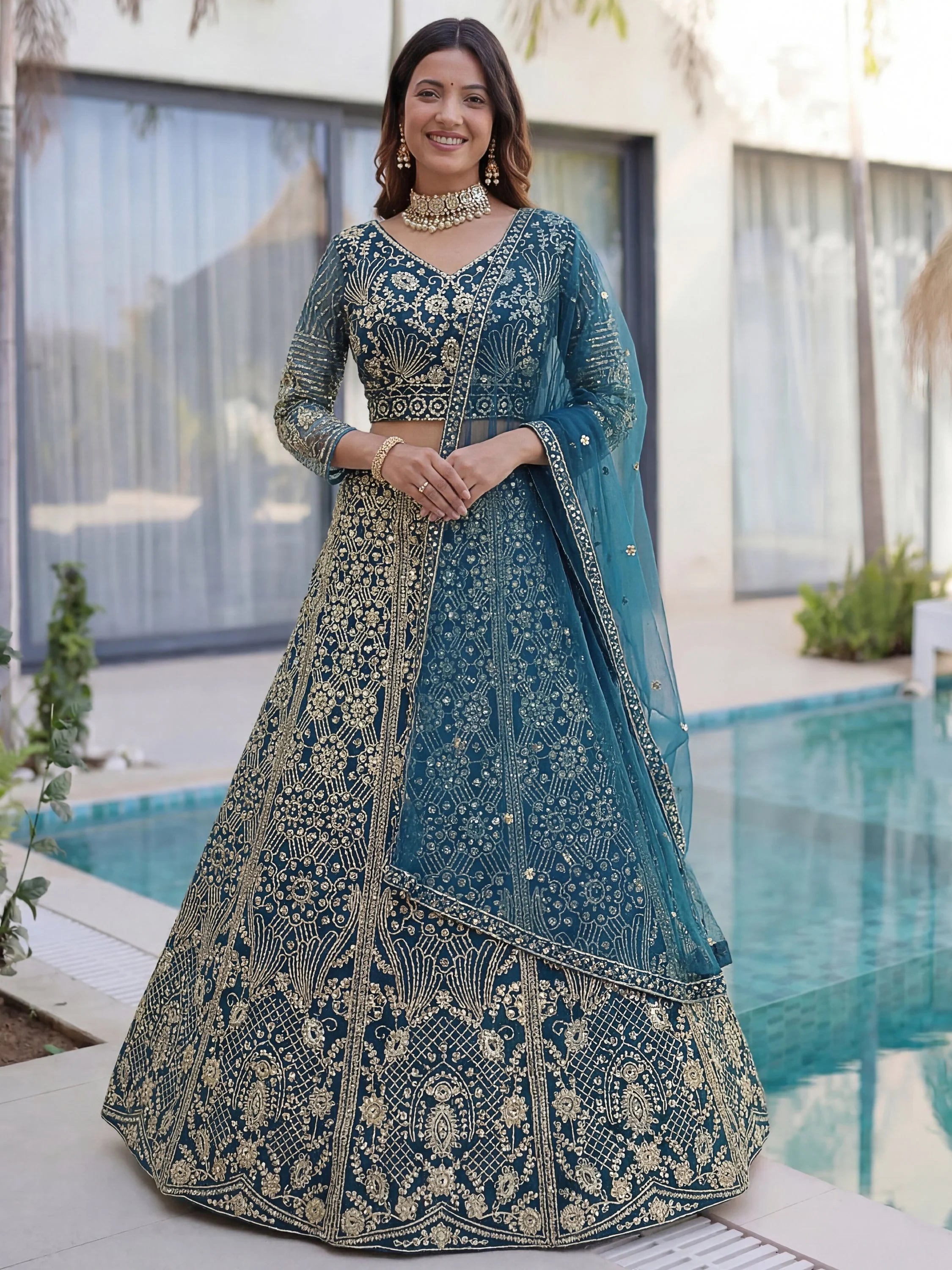 Splendid Teal Blue Sequins Net Party Wear Lehenga With Blouse