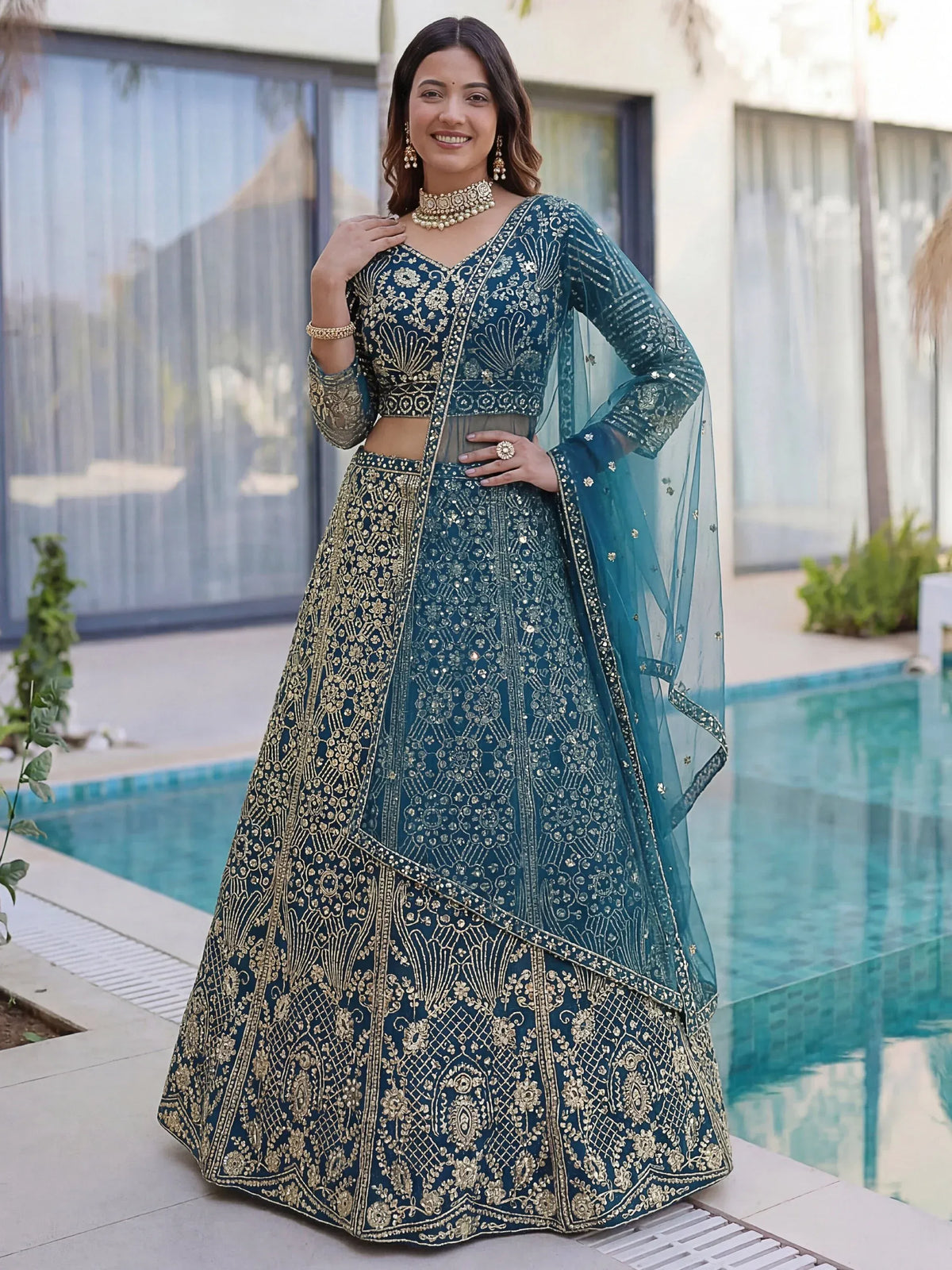 Splendid Teal Blue Sequins Net Party Wear Lehenga With Blouse