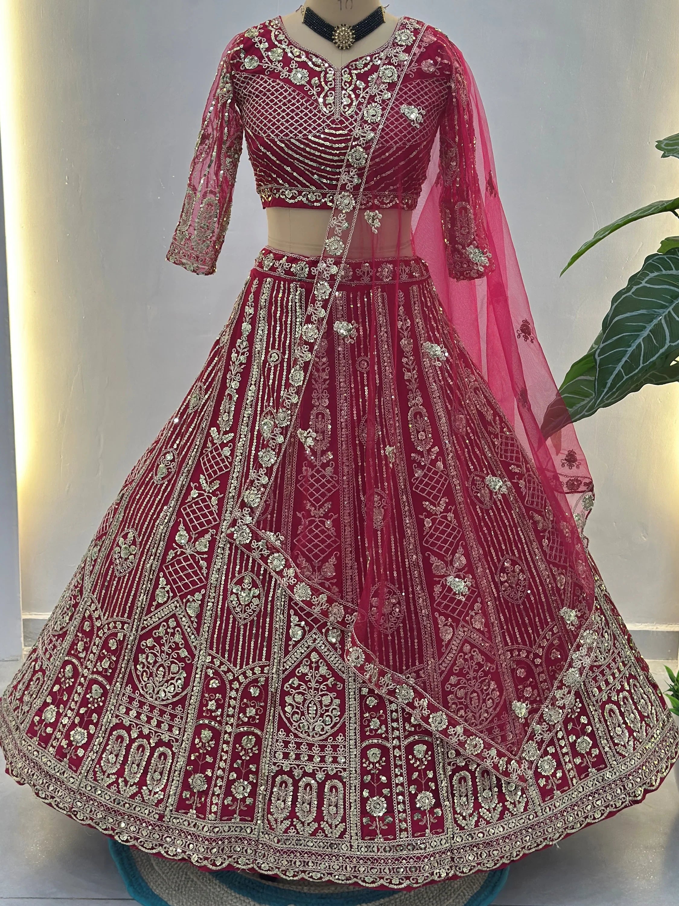 Charming Red Sequins Embroidered Net Reception Wear Lehenga Choli