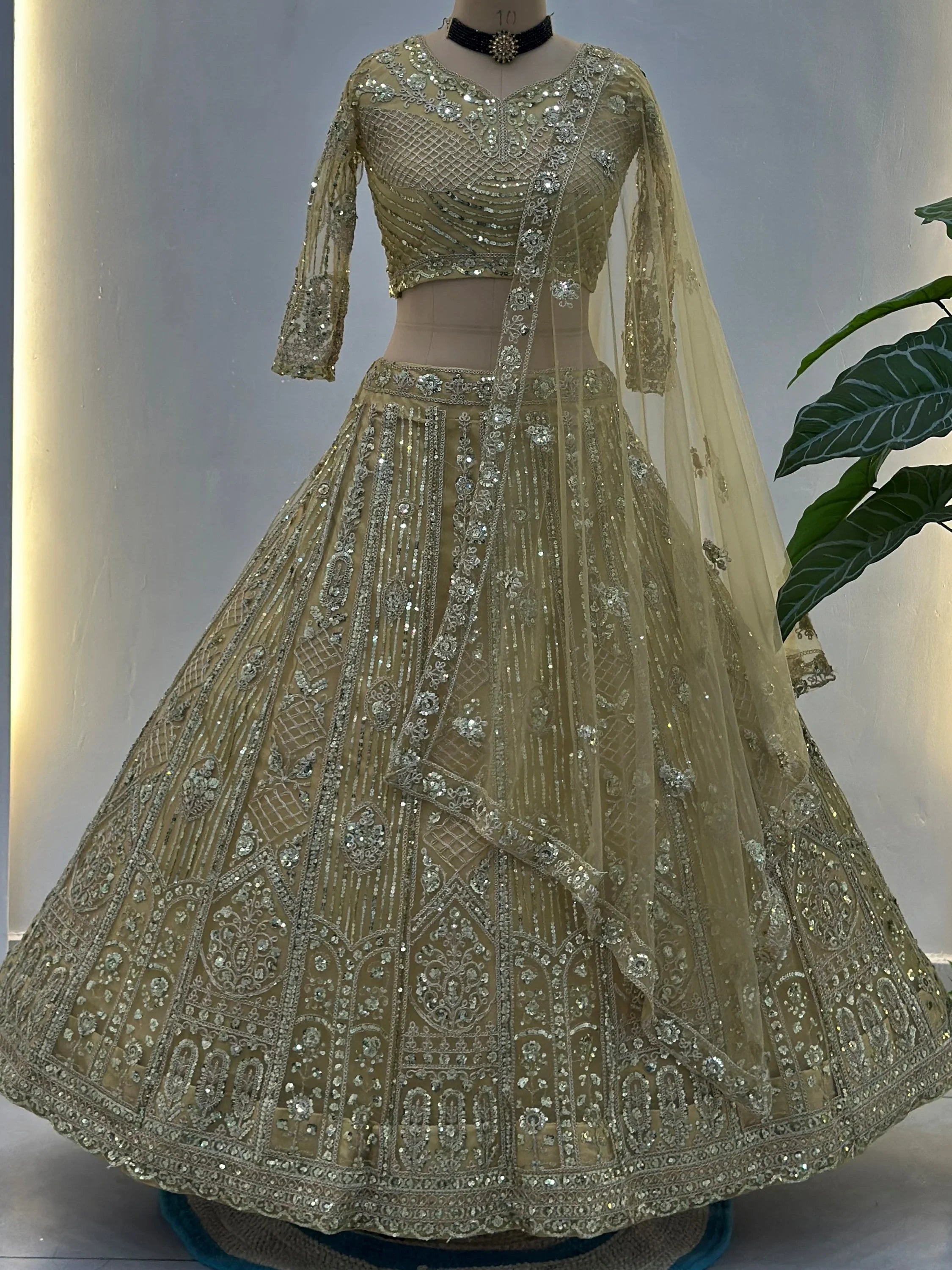 Stylish Cream Sequins Embroidered Net Wedding Wear Lehenga Choli