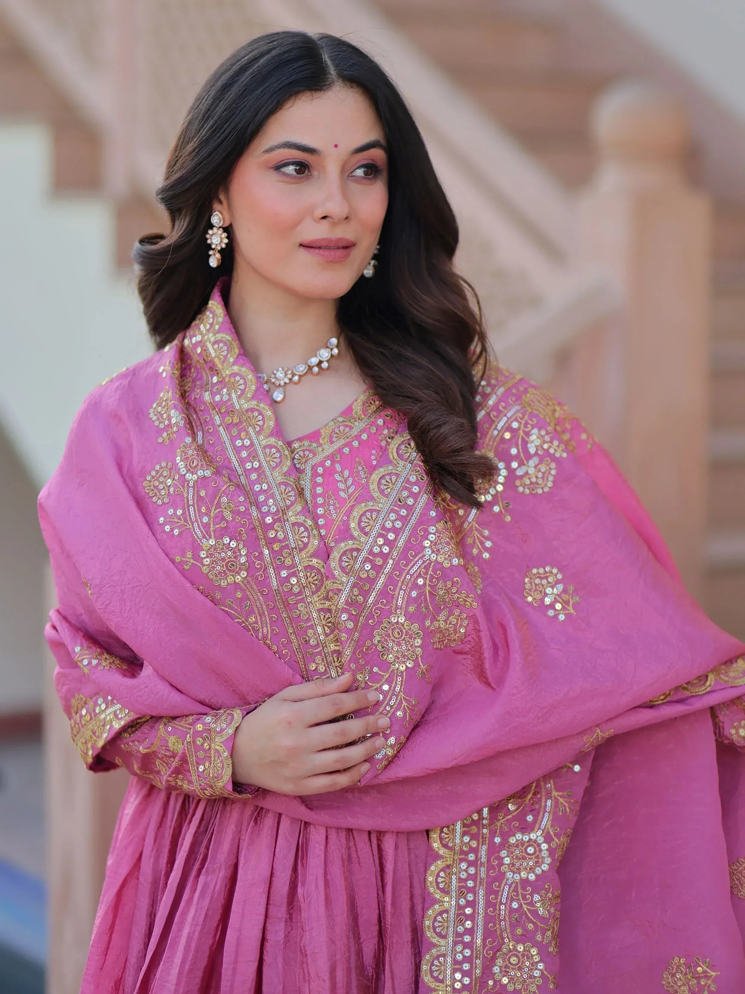 Pink embroidered Indian ethnic gown with gold detailing, perfect for festive occasions and weddings