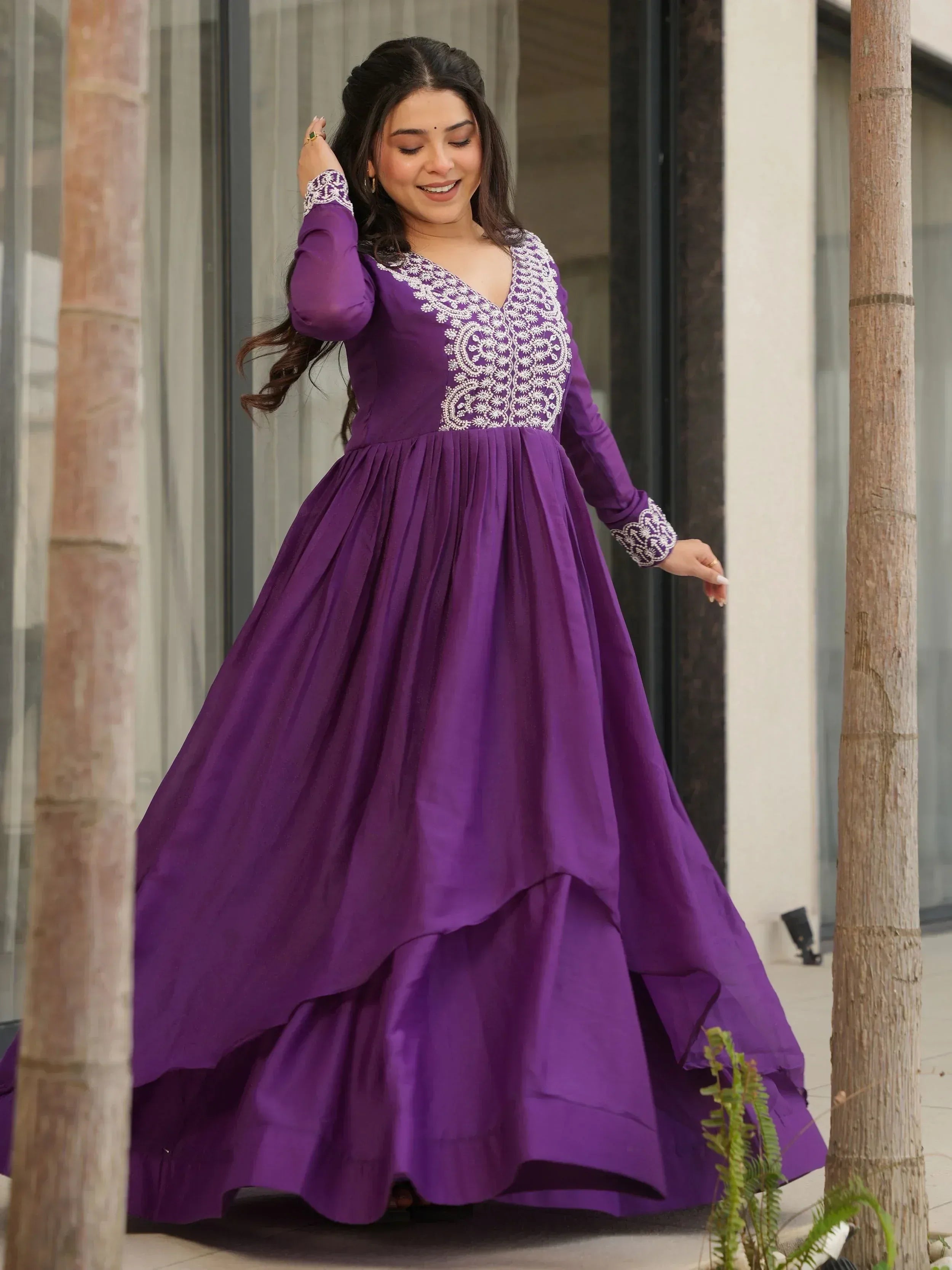 Purple ethnic gown with white embroidery, long sleeves, and flared skirt for women