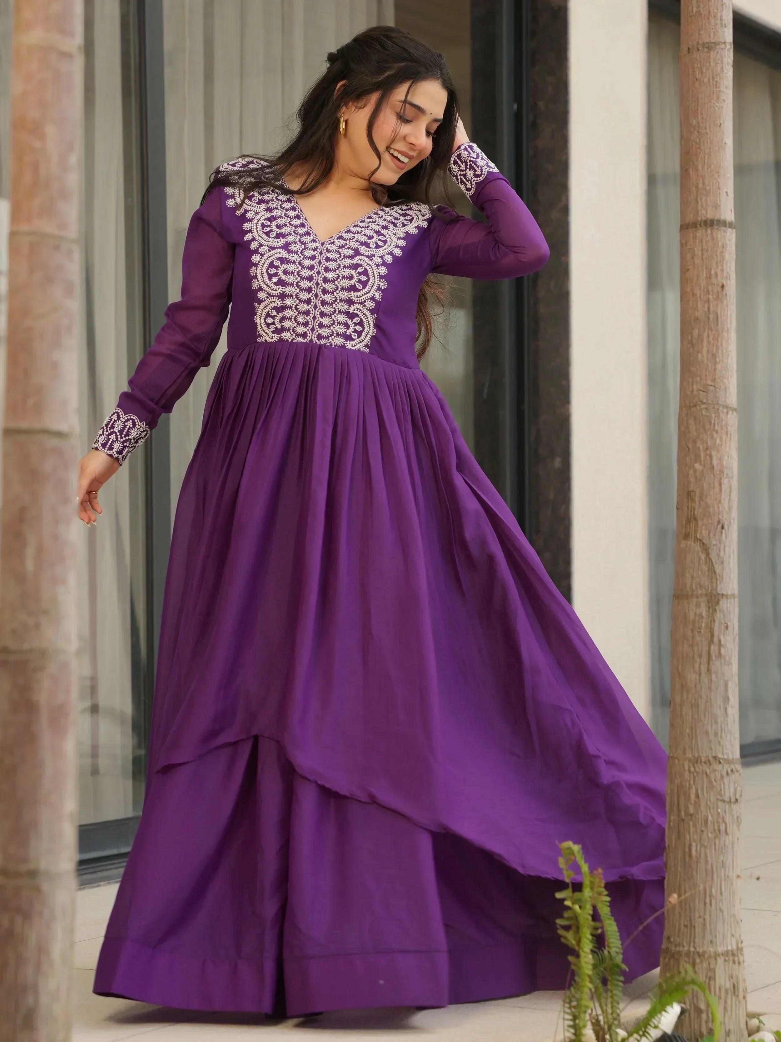 Purple ethnic gown with white embroidery, long sleeves, and flared skirt for women