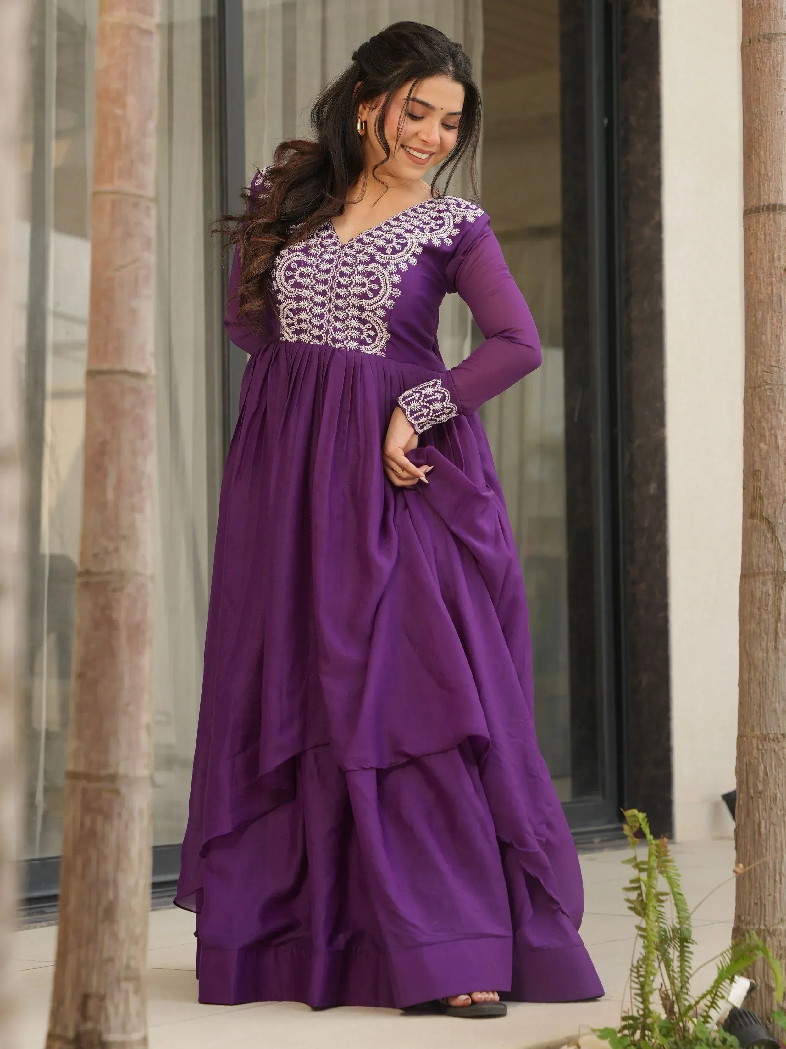 Purple ethnic gown with white embroidery, long sleeves, and tiered skirt for women
