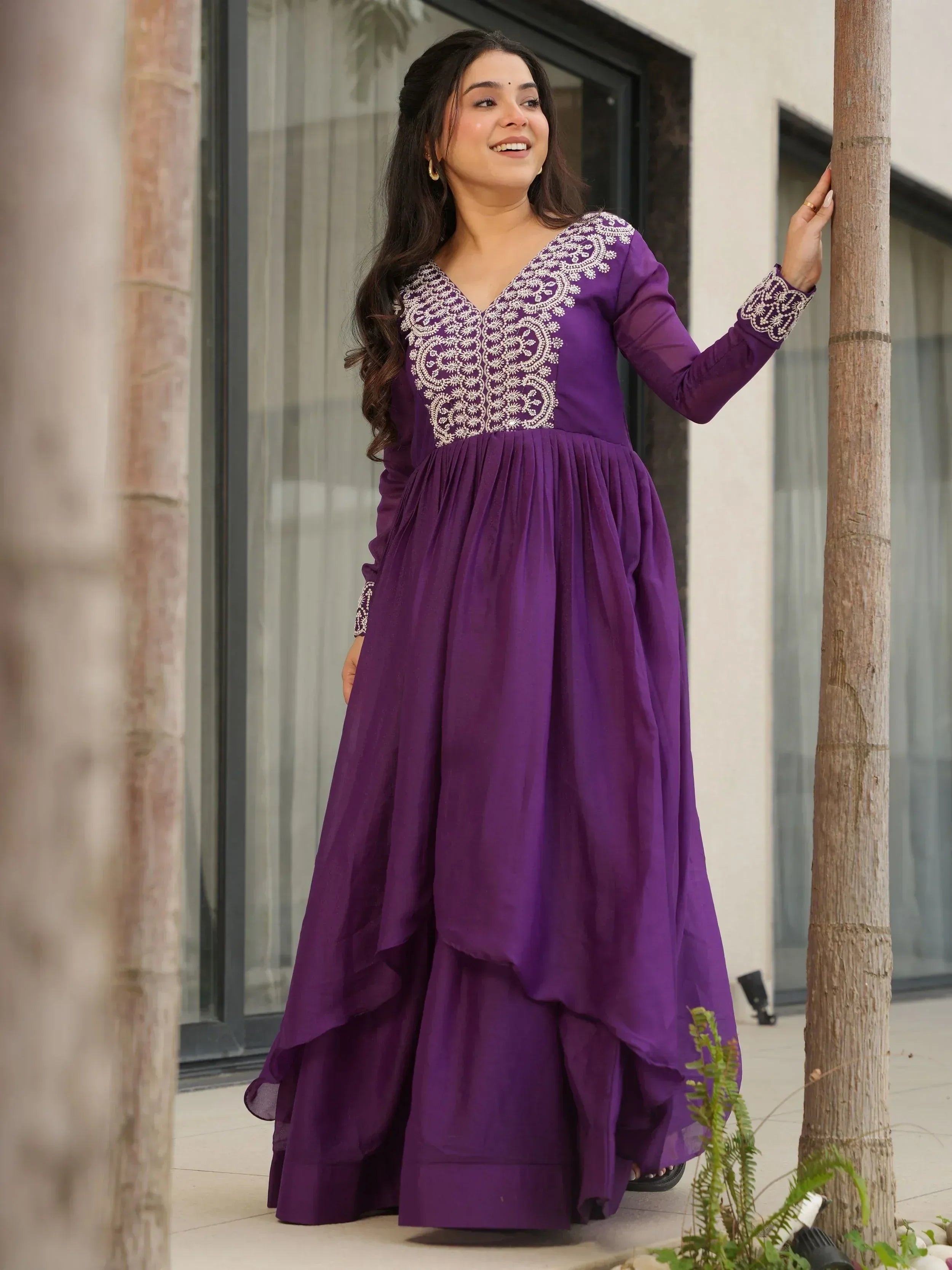 Purple ethnic gown with white embroidery, long sleeves, and layered skirt for women