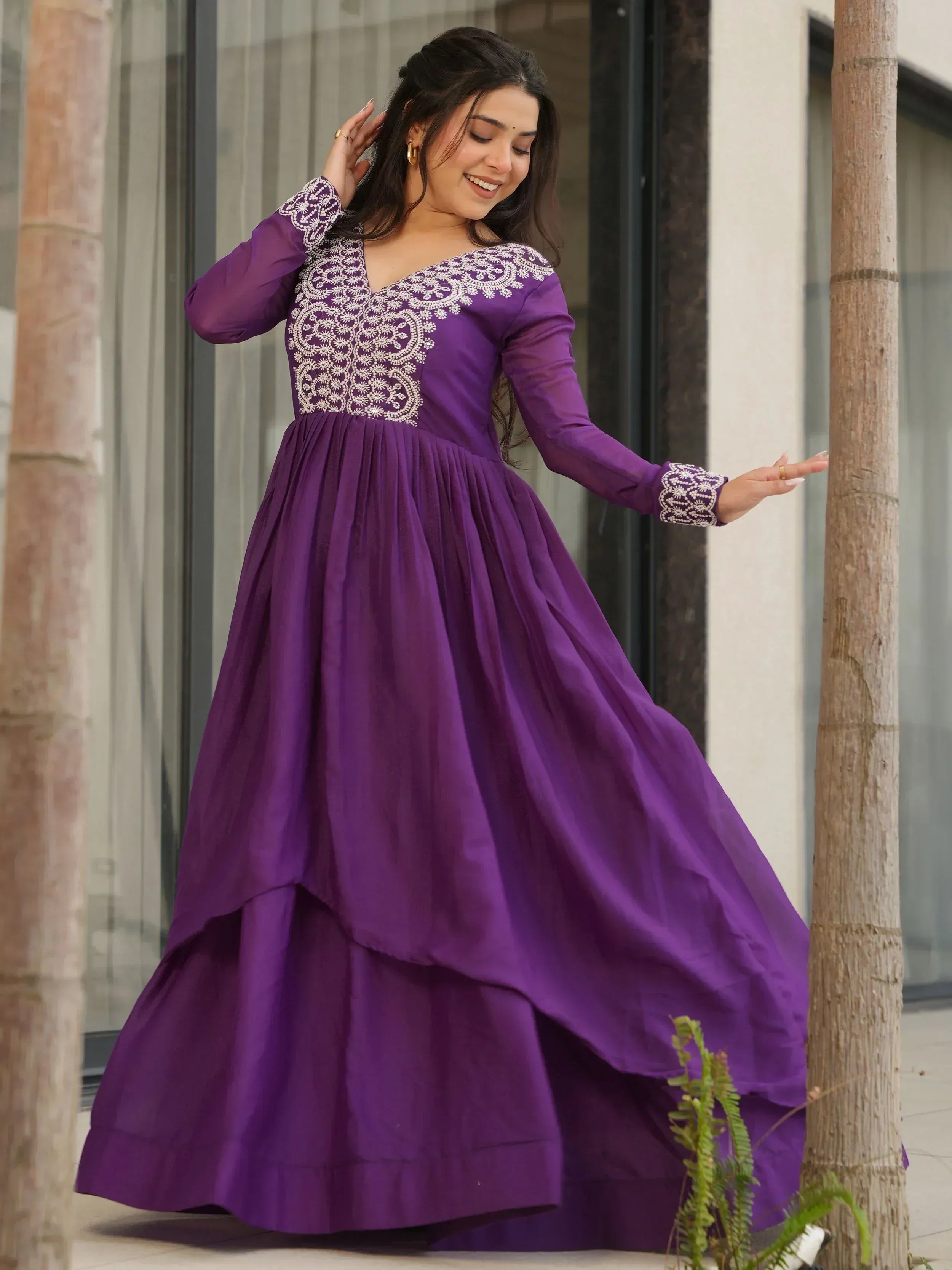 Purple ethnic gown with white embroidery, long sleeves, and flared skirt for women