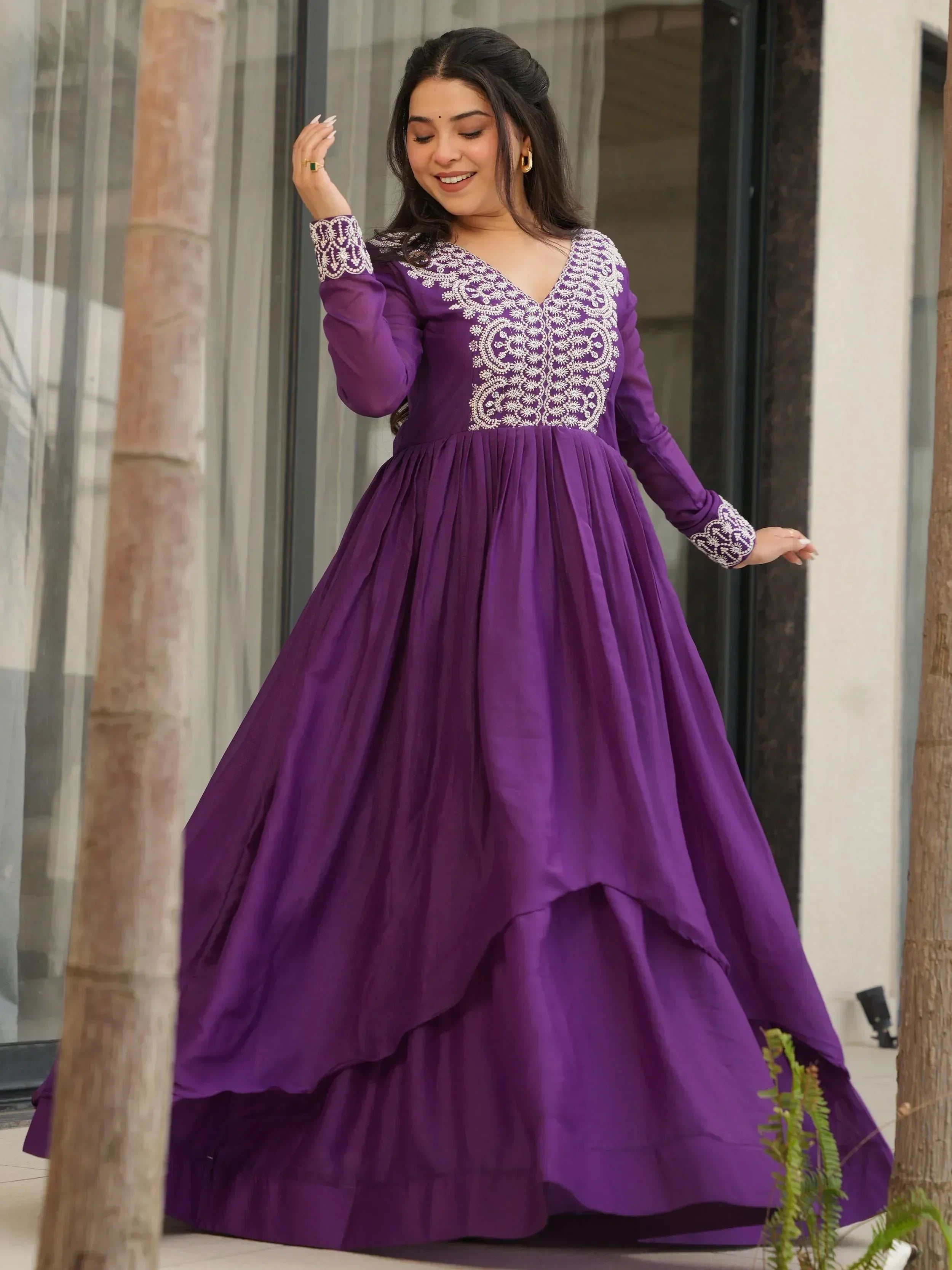 Purple ethnic gown with white embroidery, long sleeves, and flared skirt for women
