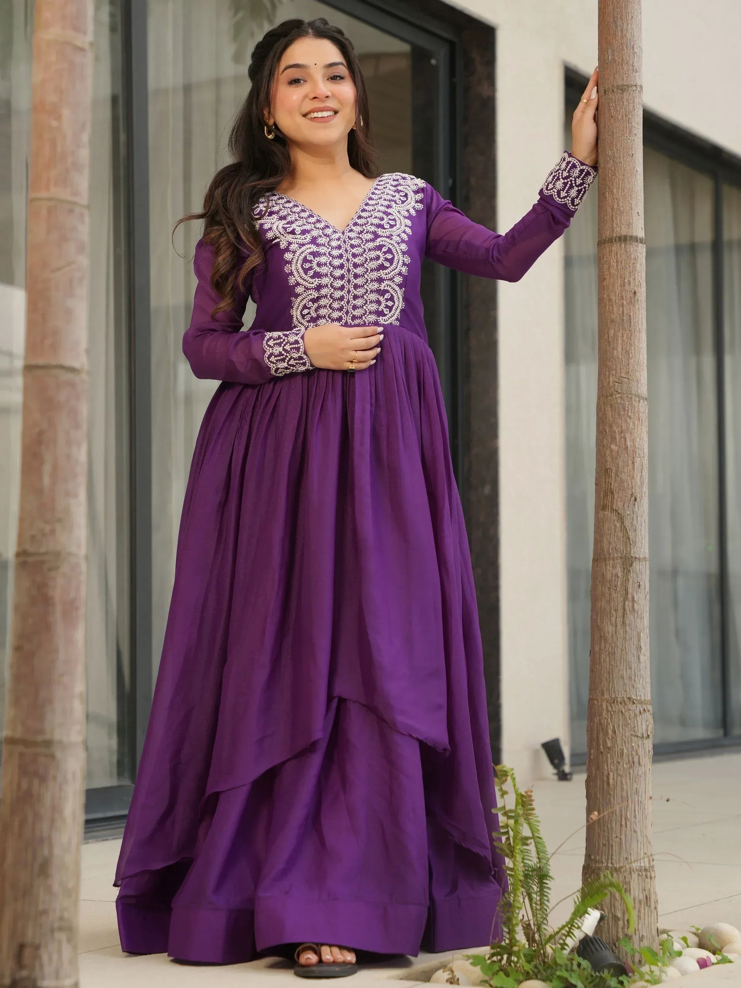 Purple ethnic gown with white embroidery, long sleeves, and layered skirt for women