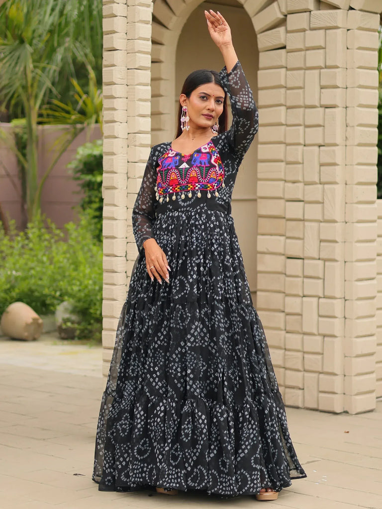 Black ethnic gown with colorful elephant embroidery and tiered skirt, perfect for Indian occasions