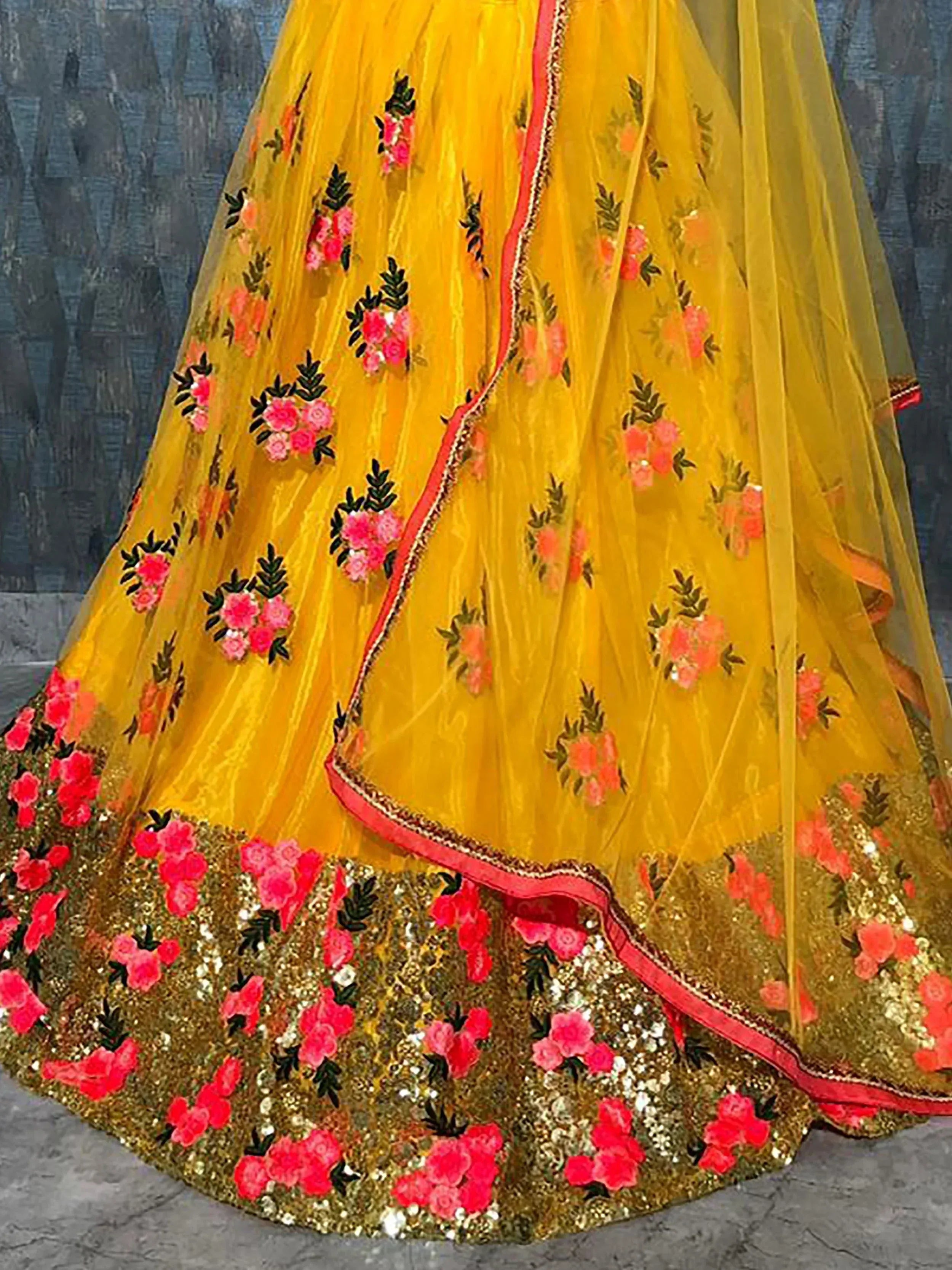 Yellow floral embroidered lehenga with pink flowers and gold sequin border, Indian ethnic wear