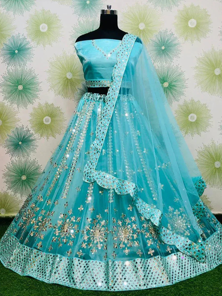 Turquoise designer lehenga choli with mirror work and floral embroidery, perfect for Indian ethnic wear events