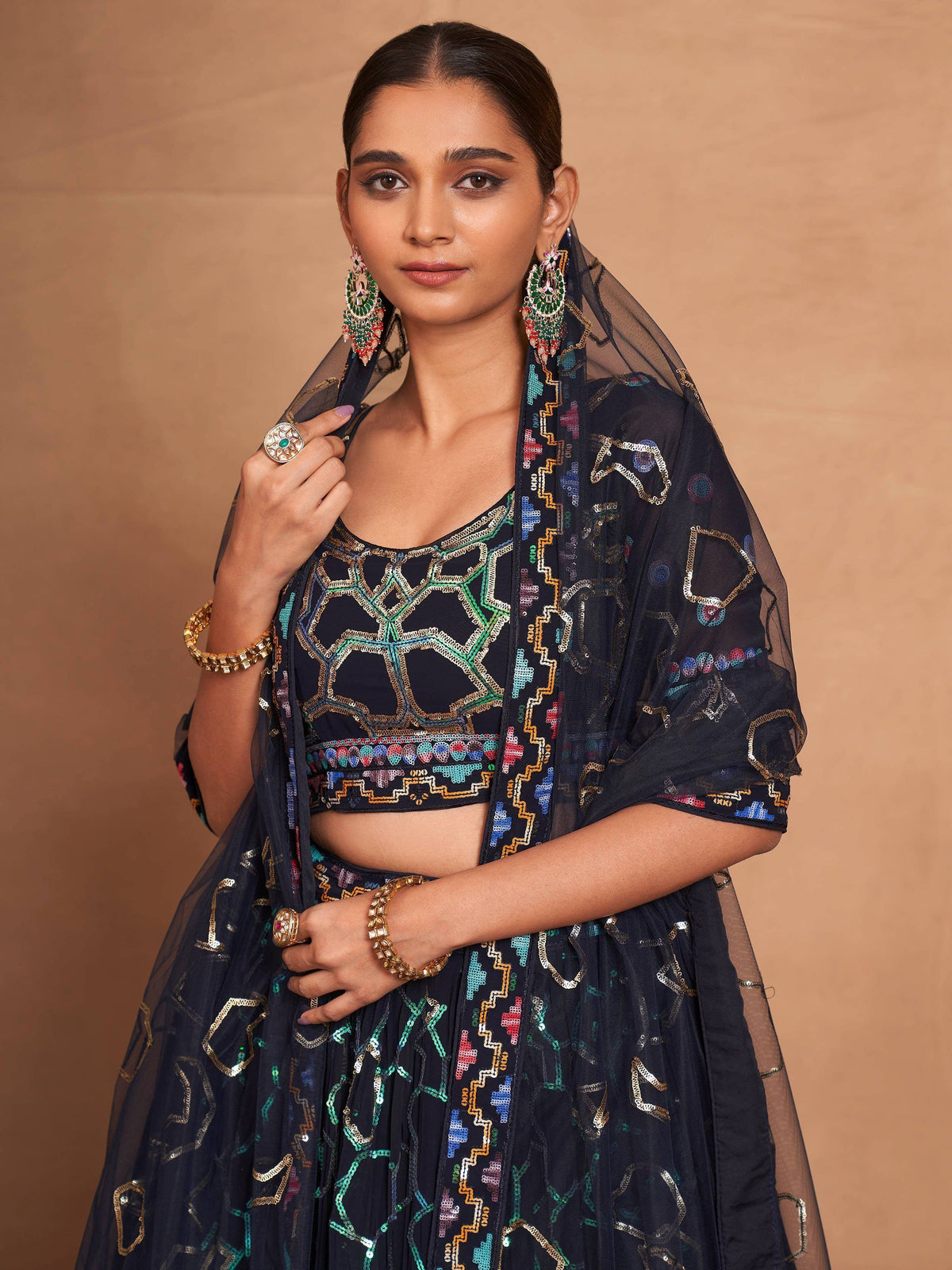 Elegant black lehenga choli with colorful geometric embroidery and matching dupatta for Indian ethnic wear