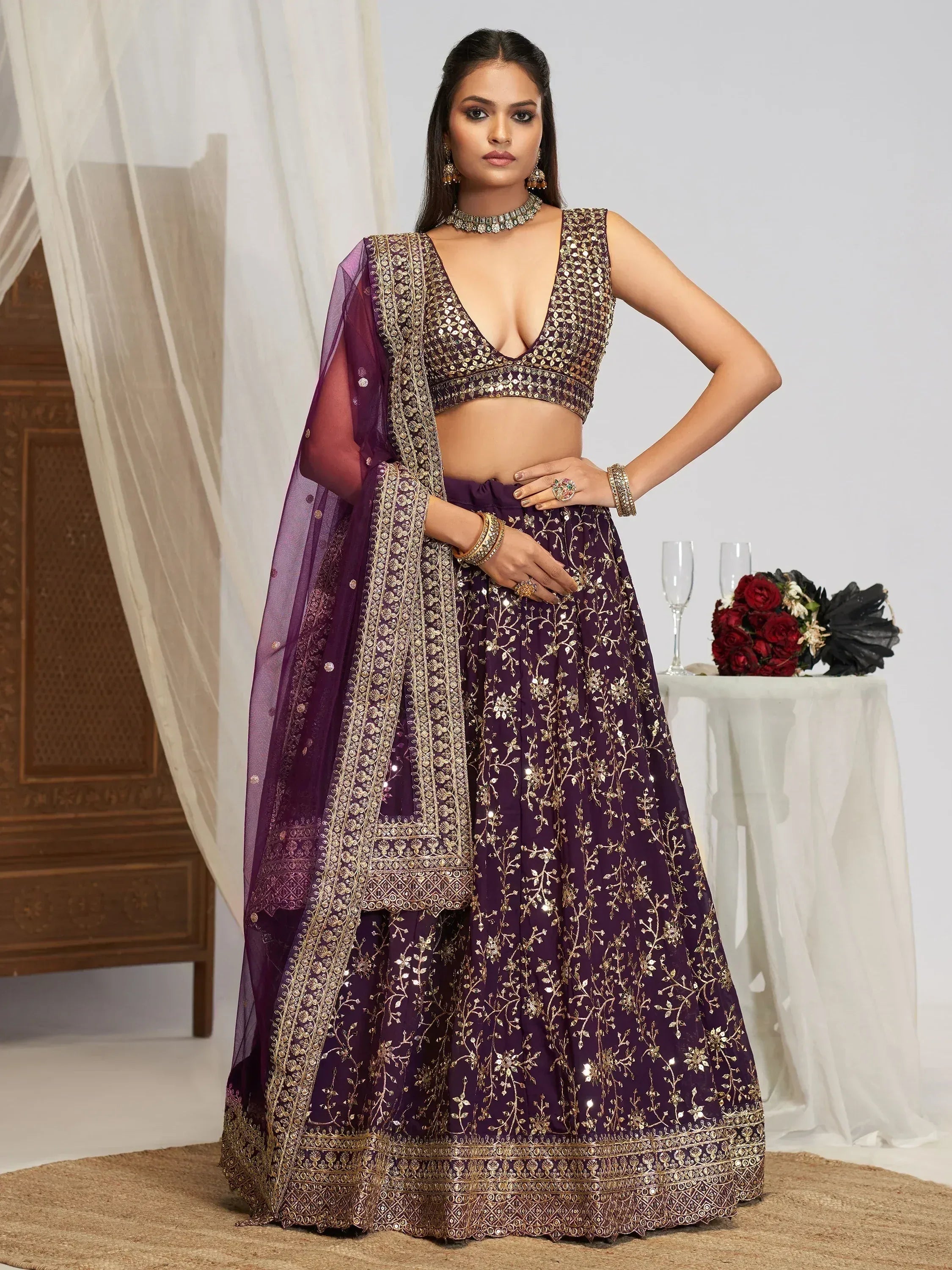 Purple and gold embroidered lehenga choli with sequin work, perfect for Indian weddings and festive occasions.