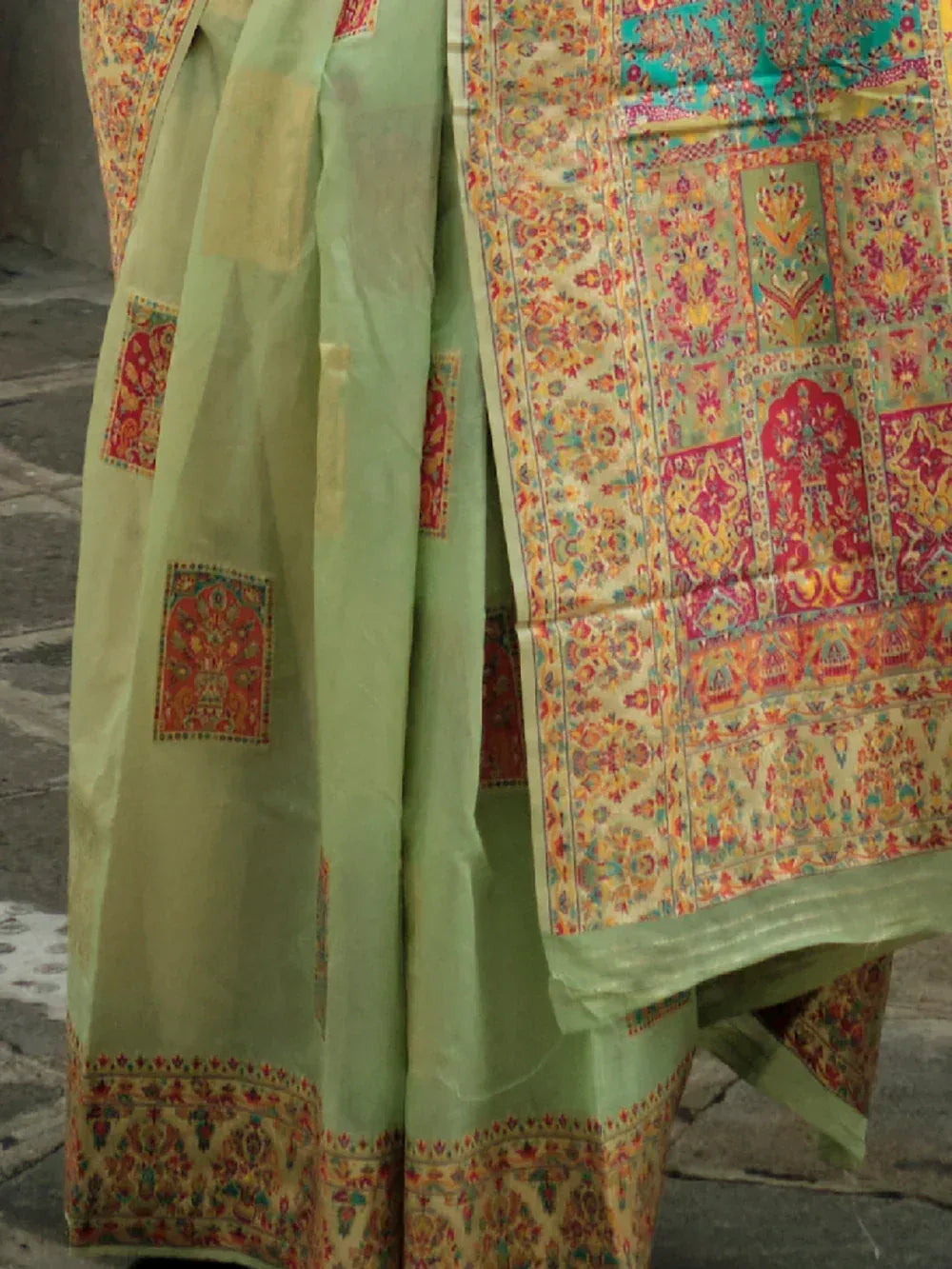 Light green ethnic saree with intricate floral and paisley print, perfect for Indian occasions