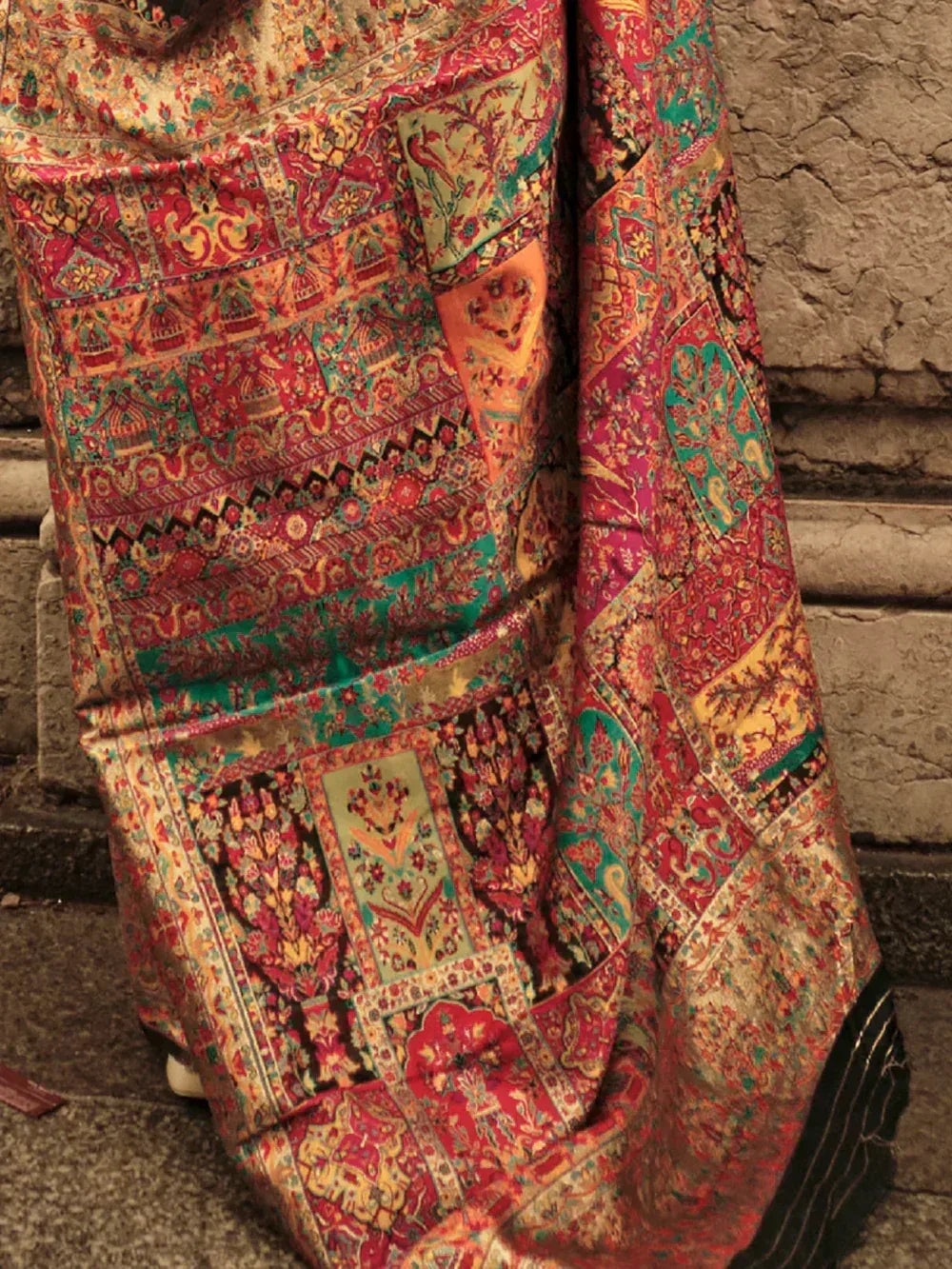 Vibrant Indian ethnic saree with intricate patchwork and floral motifs, perfect for festive occasions.