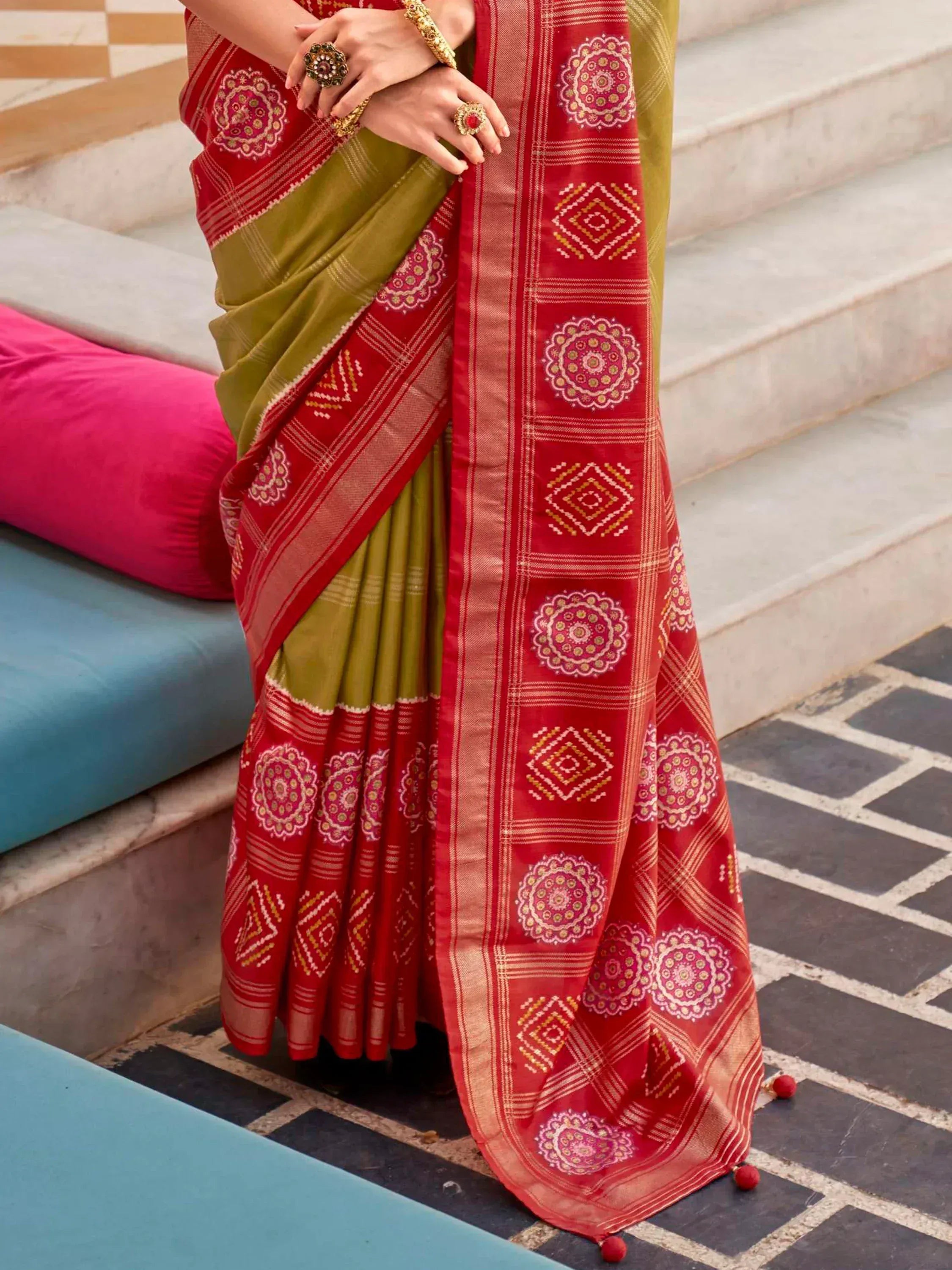 Red and olive green ethnic saree with floral and geometric prints, perfect for Indian occasions
