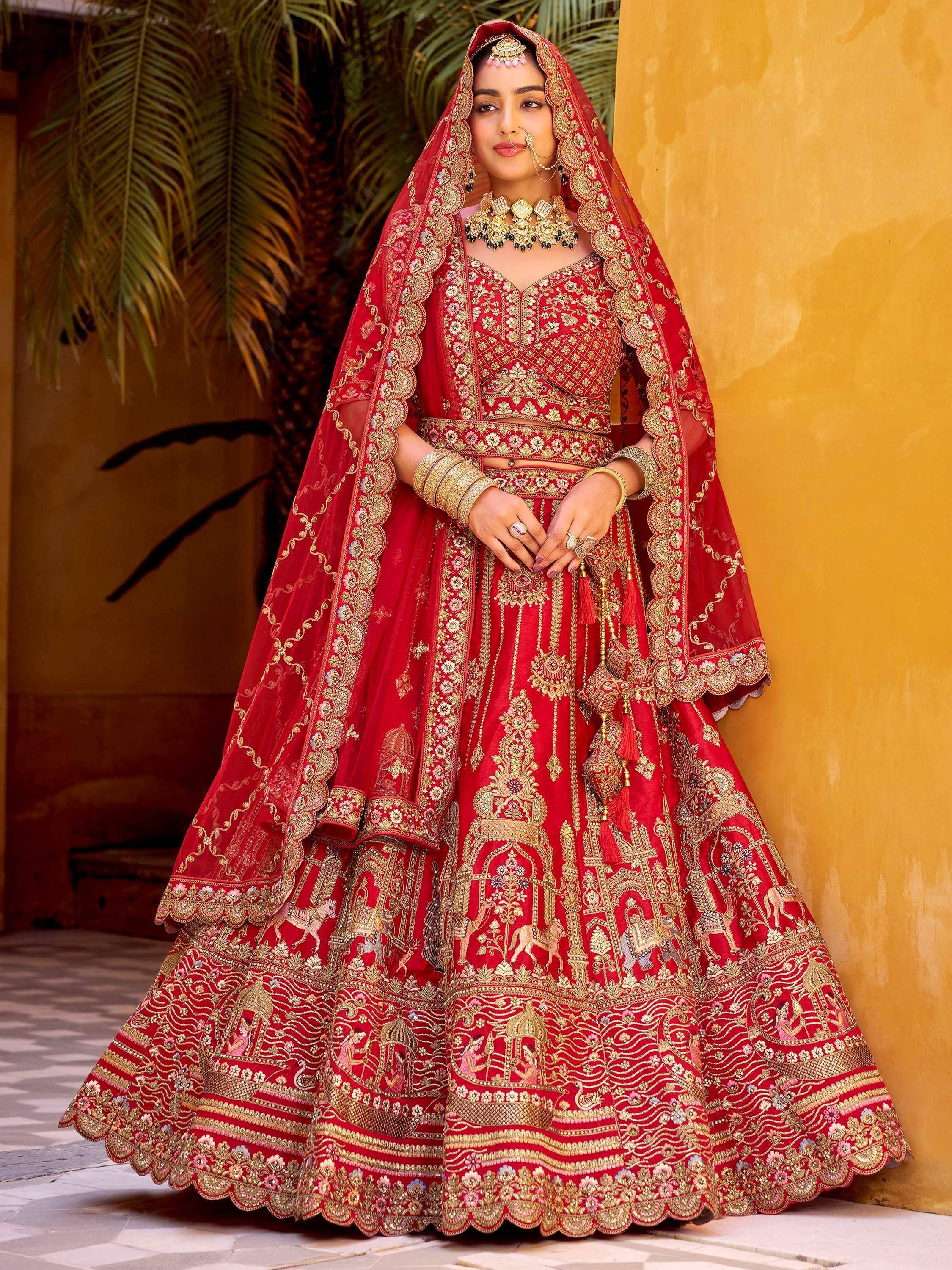 Red bridal lehenga choli with heavy gold embroidery and dupatta, traditional Indian wedding attire