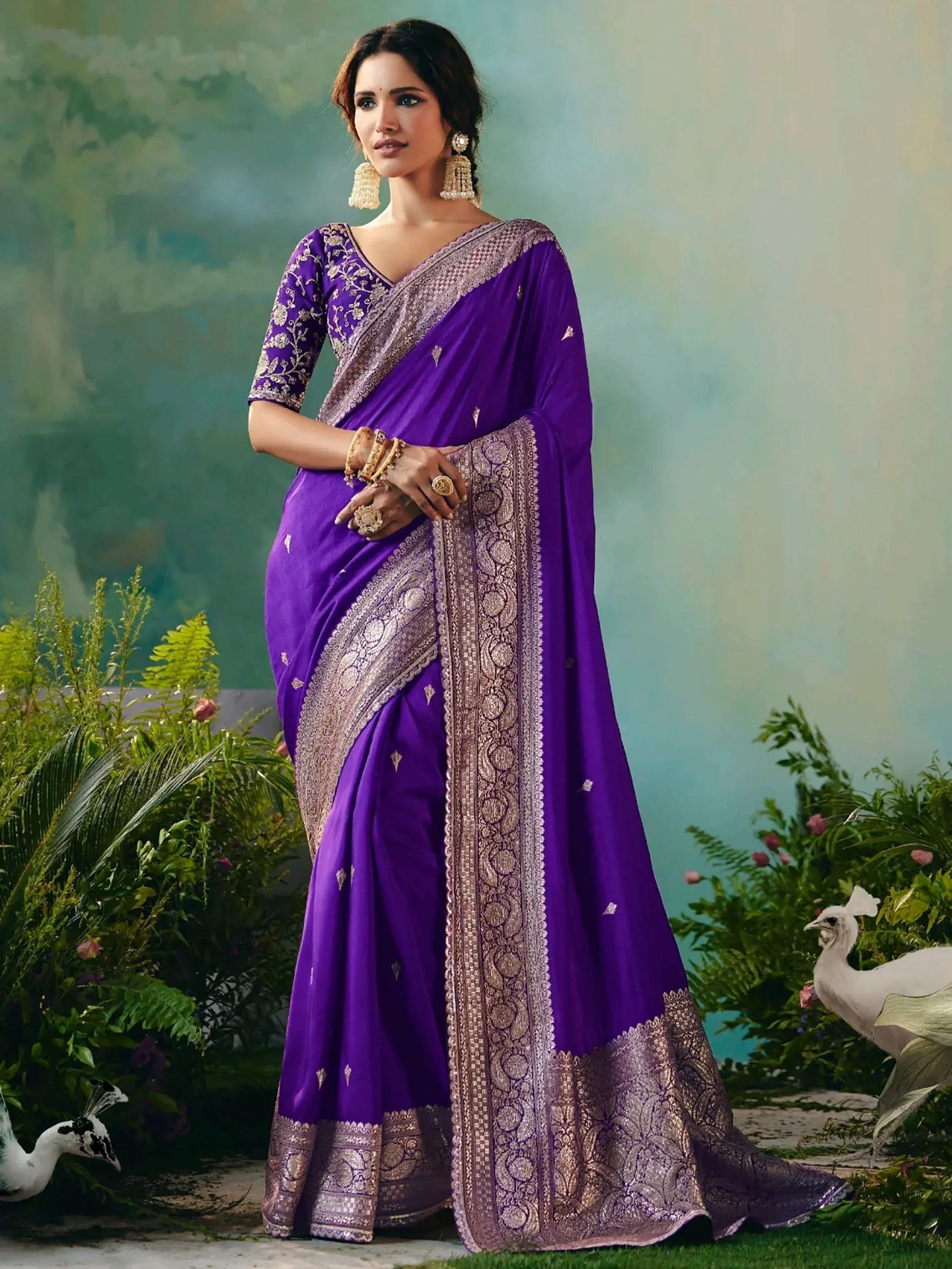 Purple embroidered saree with golden border, perfect for Indian ethnic occasions and festive wear.