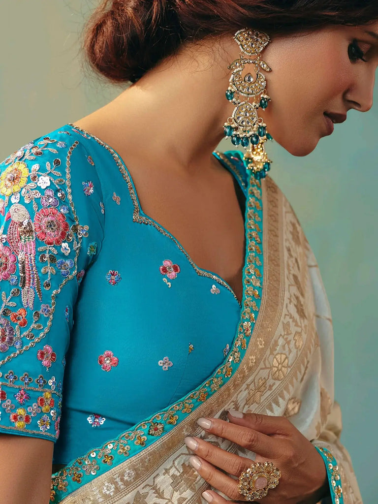 Stunning Off-White Hand Embroidered Tissue Festival Wear Saree With Blouse