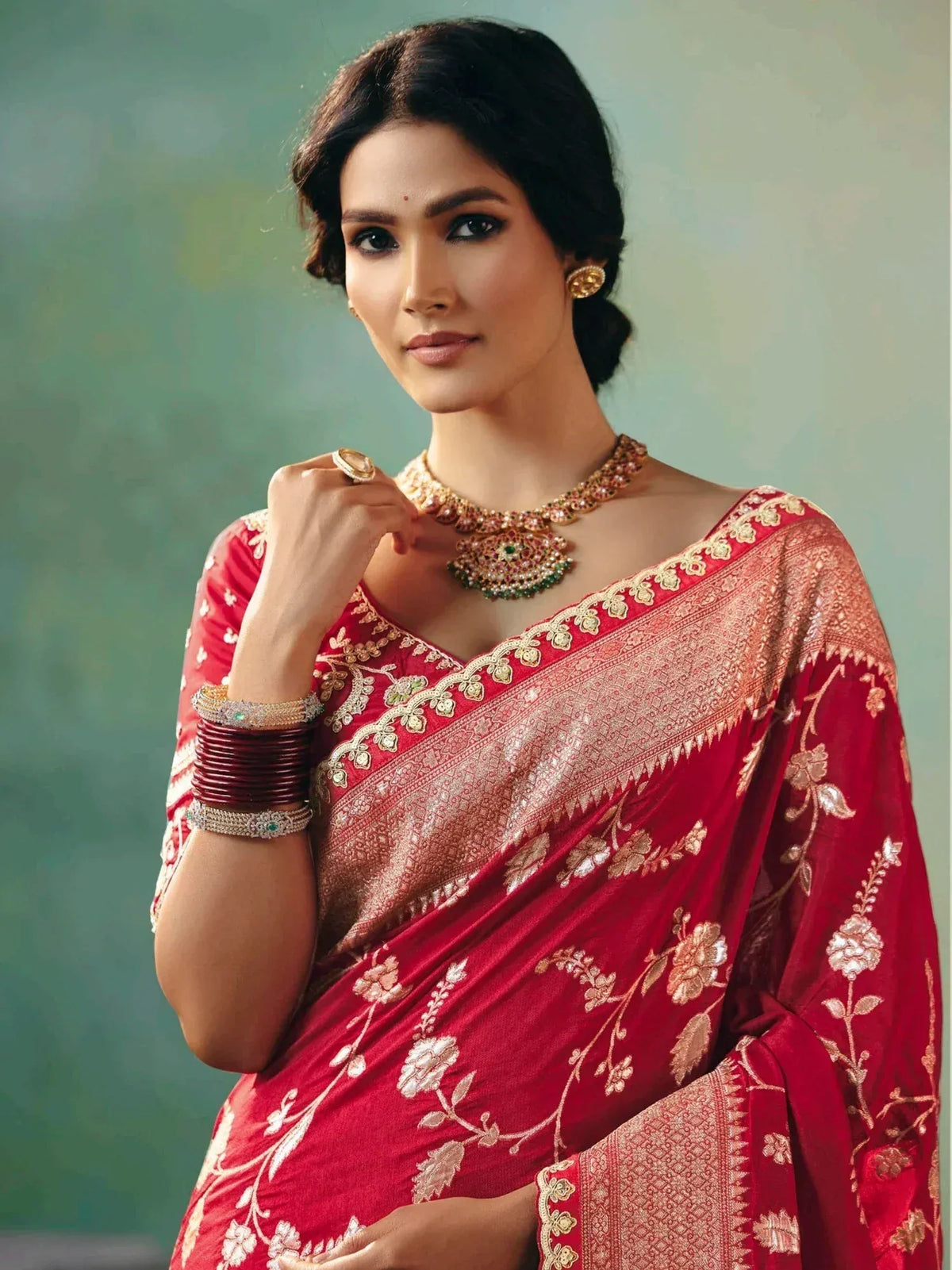 Elegant red embroidered saree with gold floral design, perfect for Indian ethnic wear occasions