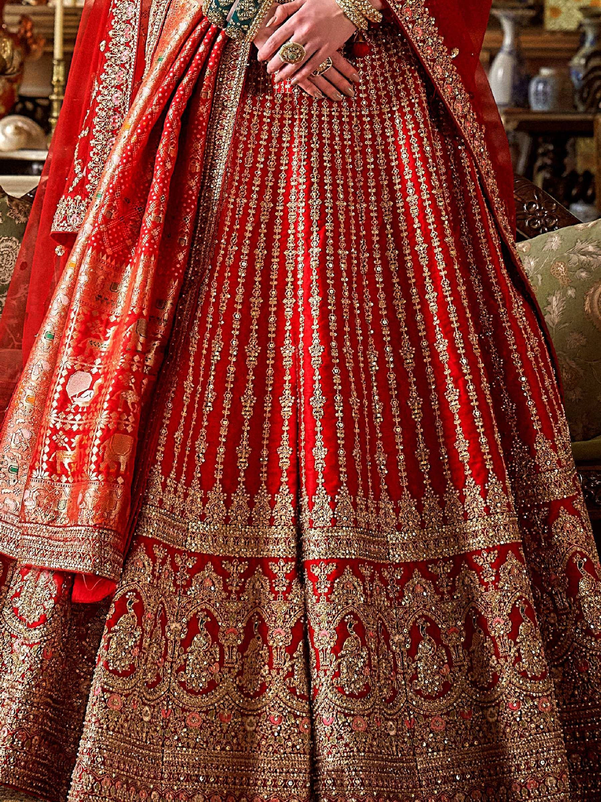 Red bridal lehenga with gold embroidery and peacock motifs, Indian ethnic wear