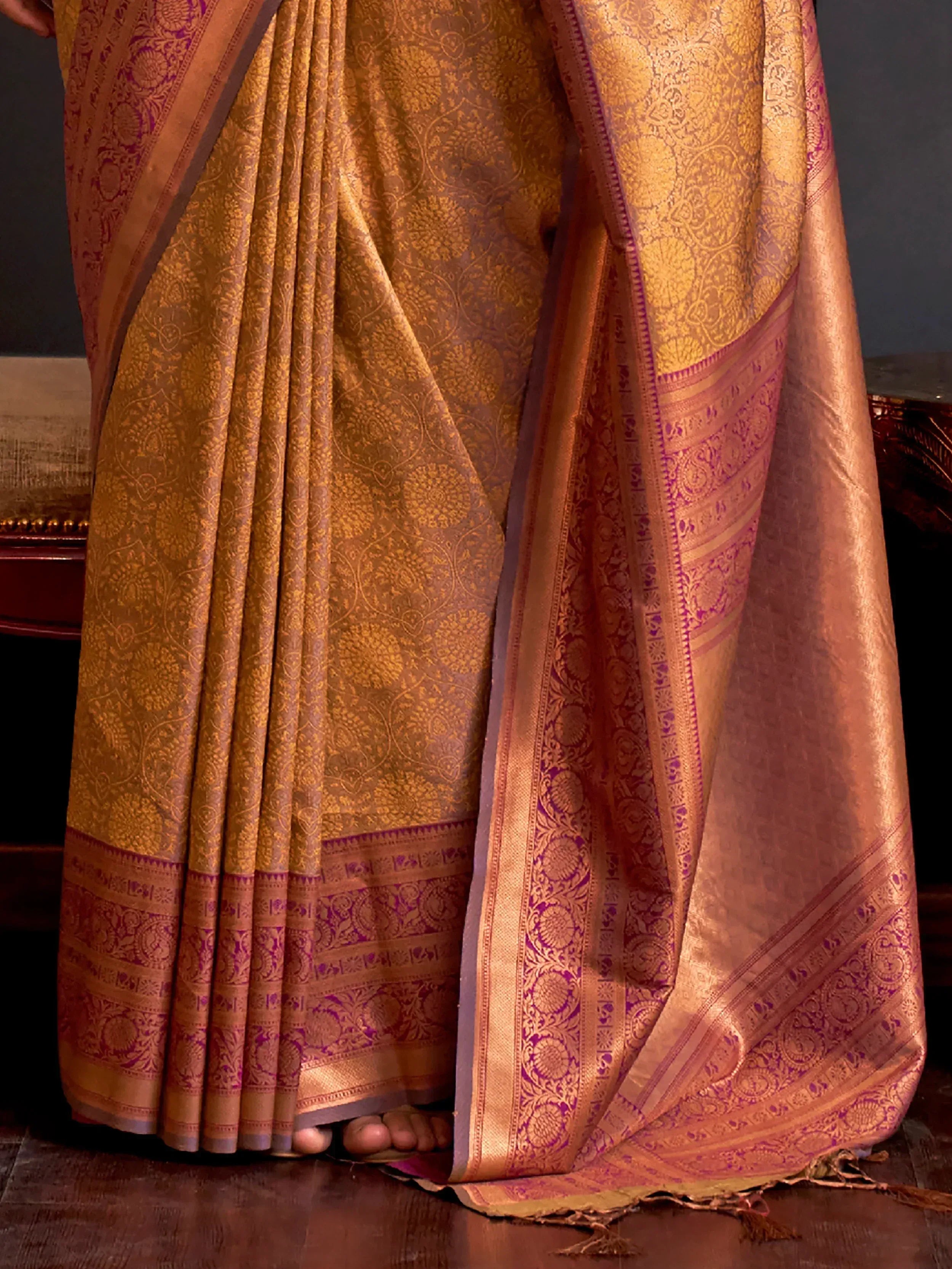 Golden designer saree with intricate purple border, perfect for Indian ethnic wear occasions