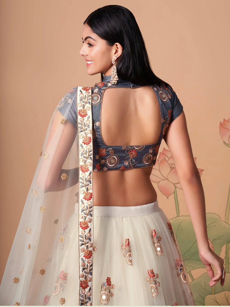 Pretty Ivory Embroidered Net Party Wear Lehenga Choli