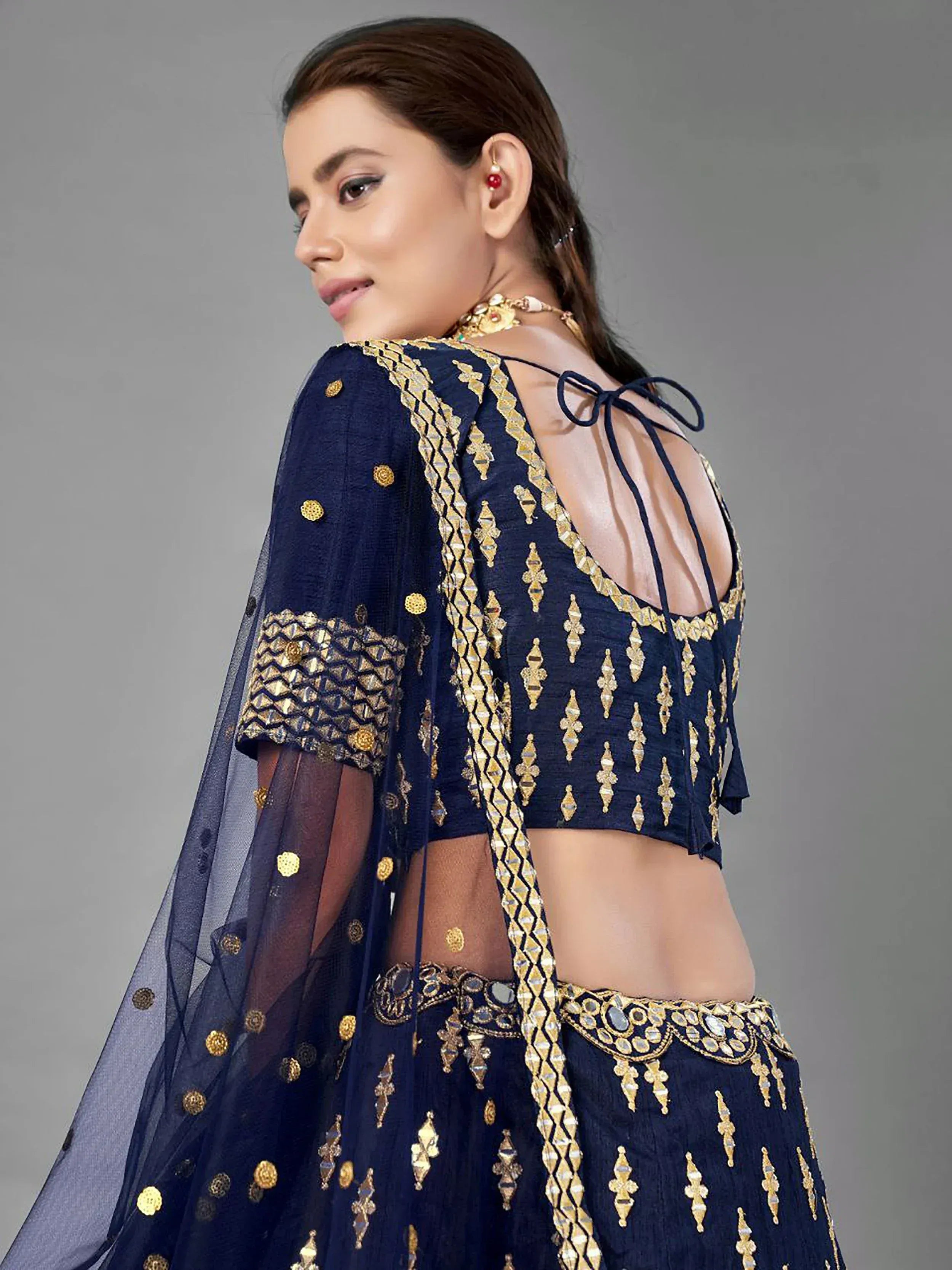 Navy blue designer lehenga choli with gold embroidery and back tie detail, ethnic Indian wear