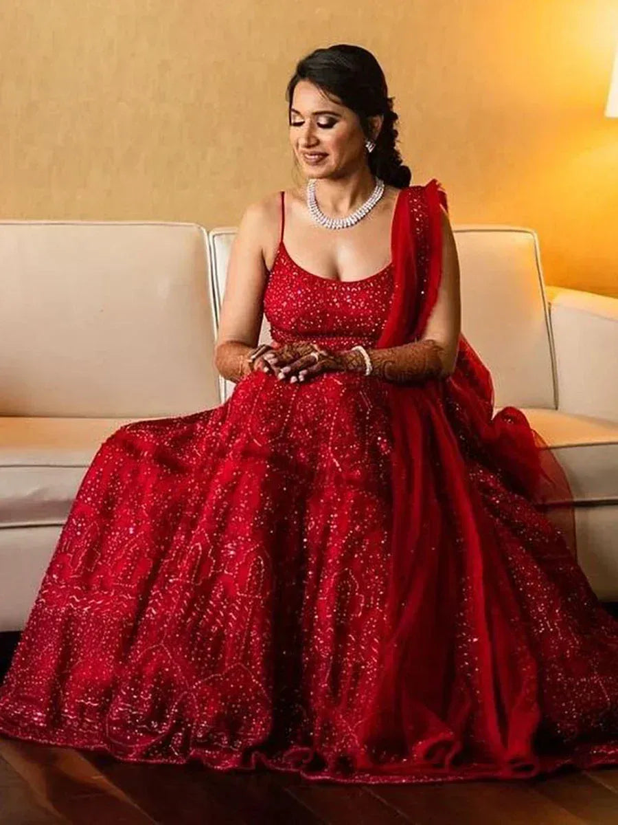 Red designer lehenga choli with sequin work, perfect for Indian weddings and festive occasions