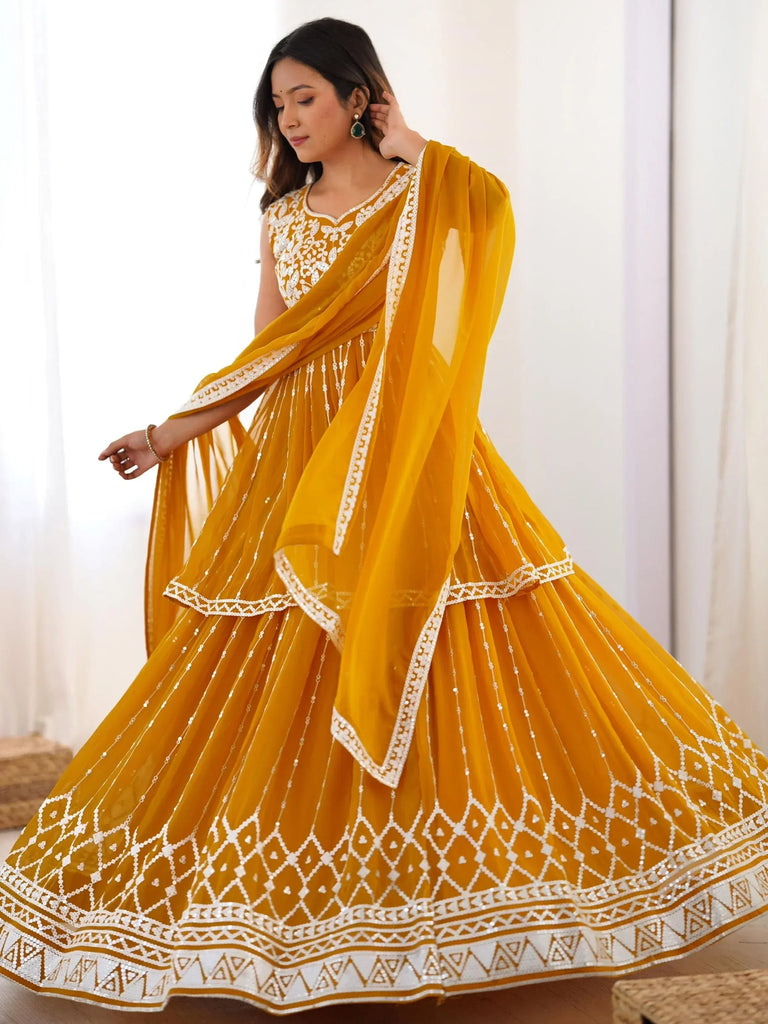 Yellow designer lehenga choli with white embroidery and sequin work, perfect for Indian ethnic wear