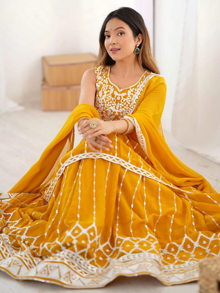 Yellow designer lehenga choli with white embroidery, perfect for Indian ethnic wear occasions