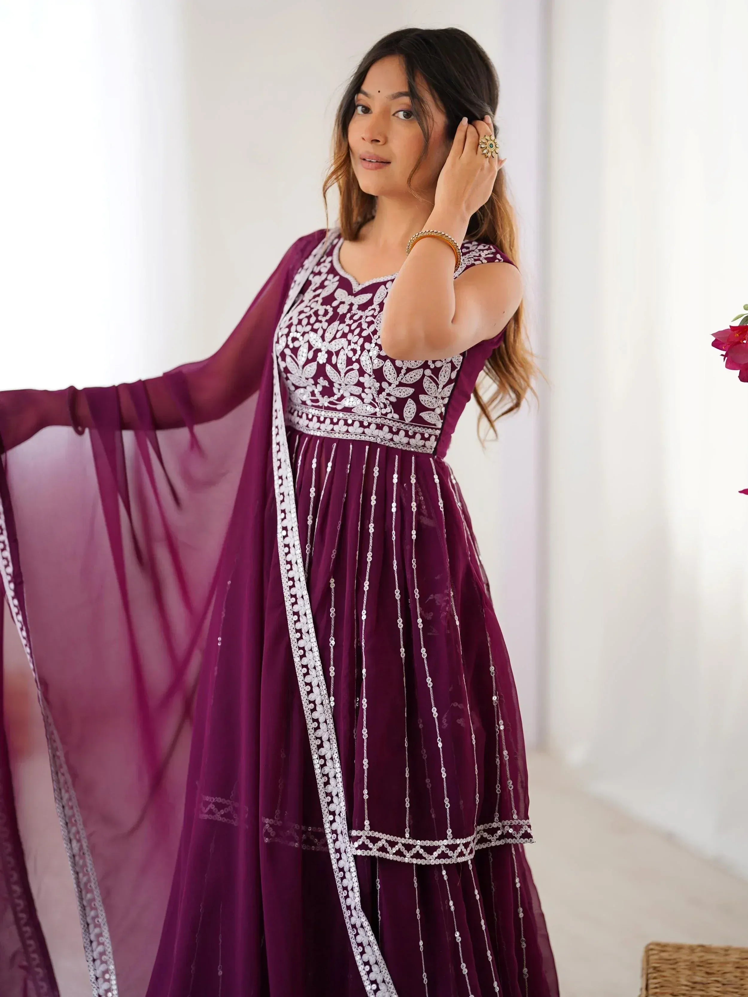 Purple ethnic gown with white embroidery and sequins, perfect for Indian occasions